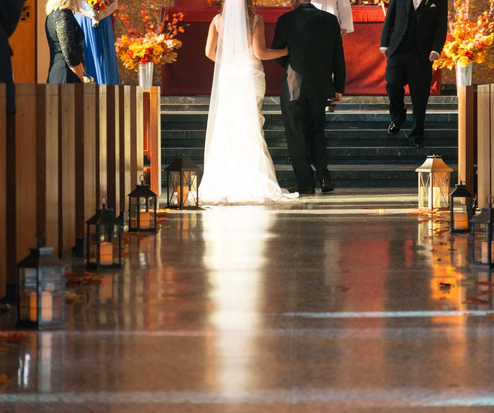 Bride and Her Father Walking Down Aisle in Church | Photo: Shutterstock