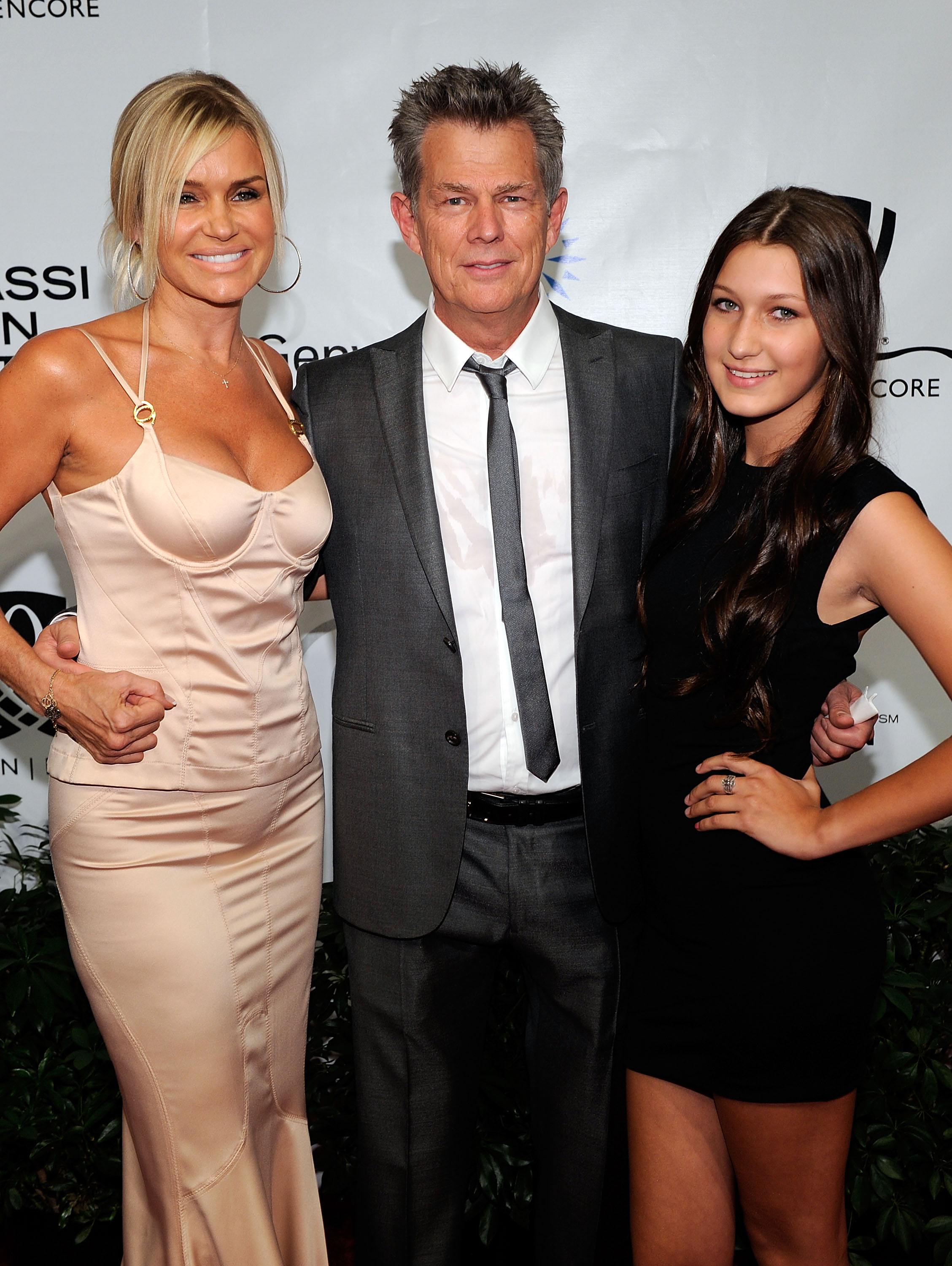 Bella Hadid with her mother, Yolanda Hadid, and music producer, David Foster, at the Andre Agassi Foundation for Education's 15th Grand Slam for Children benefit concert at the Wynn Las Vegas on October 9, 2010 in Las Vegas, Nevada | Source: Getty Images