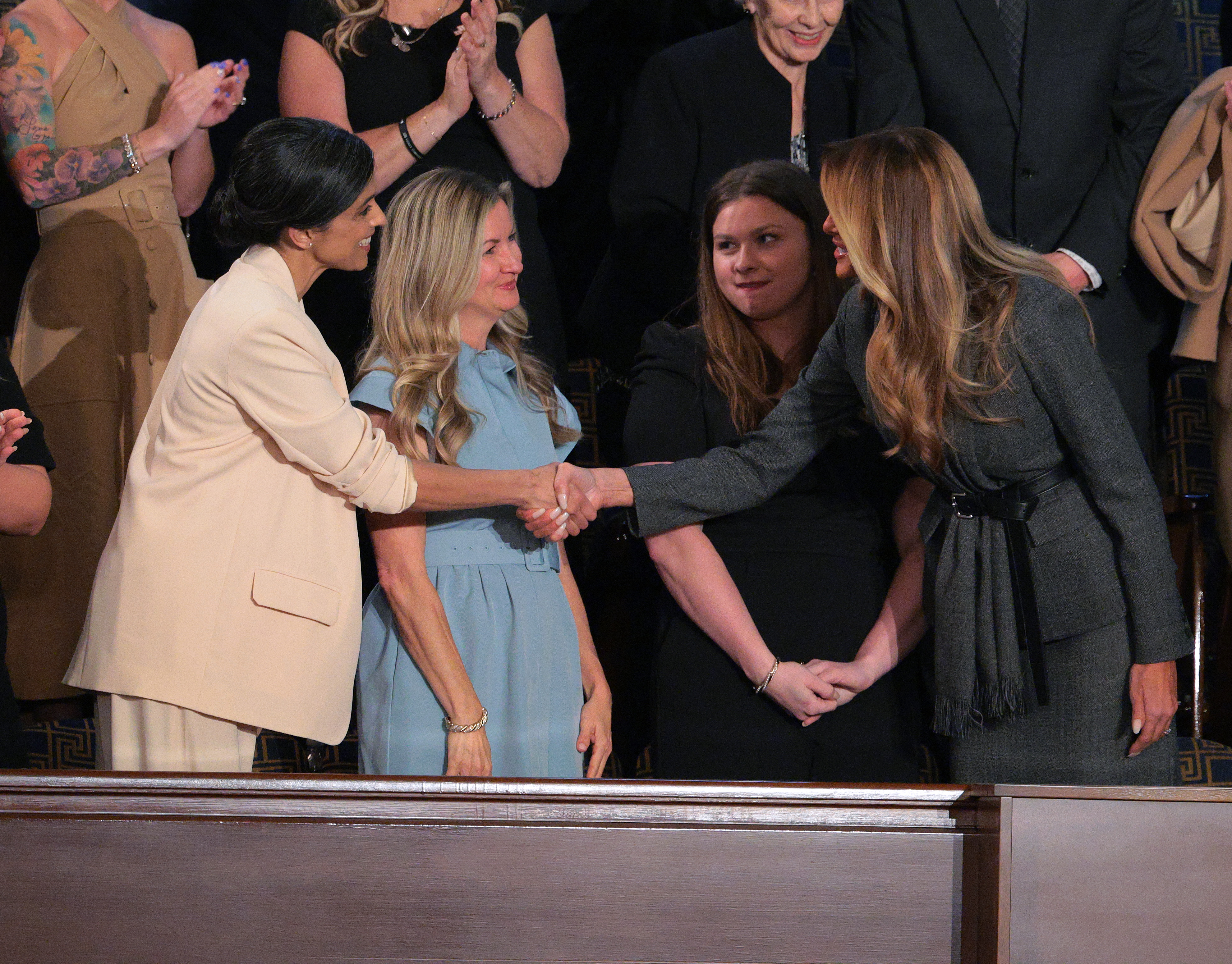 Melania Trump shakes the hand of Second Lady Usha Vance ahead of Donald Trump's address to a joint session of Congress | Source: Getty Images