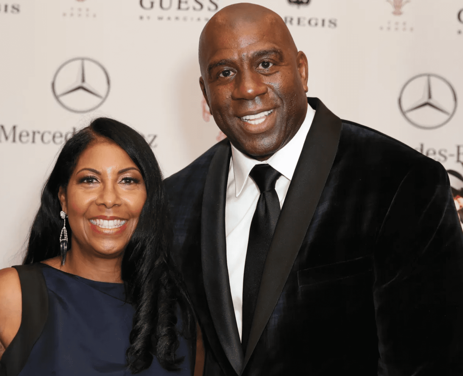 Magic Johnson and wife Cookie Johnson arrive at the 2014 Carousel of Hope Ball presented by Mercedes-Benz on October 11, 2014. | Source: Getty Images