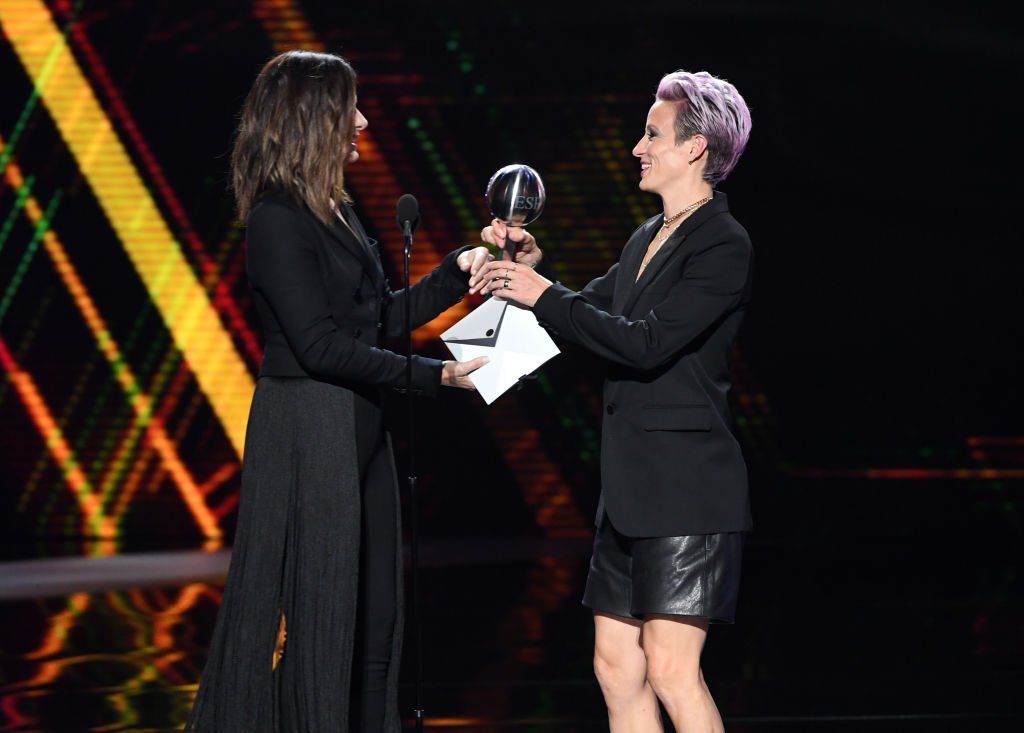 Sandra Bullock presents the Best Team award to Megan Rapinoe of the United States Women's National Soccer Team onstage during The 2019 ESPYs at Microsoft Theater | Getty Images