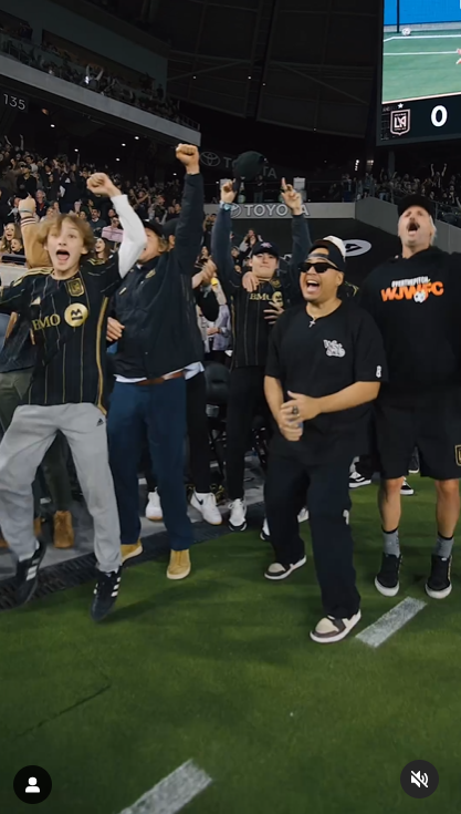 A screenshot captures Owen Wilson, his son Ford, and other supporters of the Los Angeles football team in a celebratory mood, in a video shared on Instagram in April 2024. | Source: Instagram/lafc