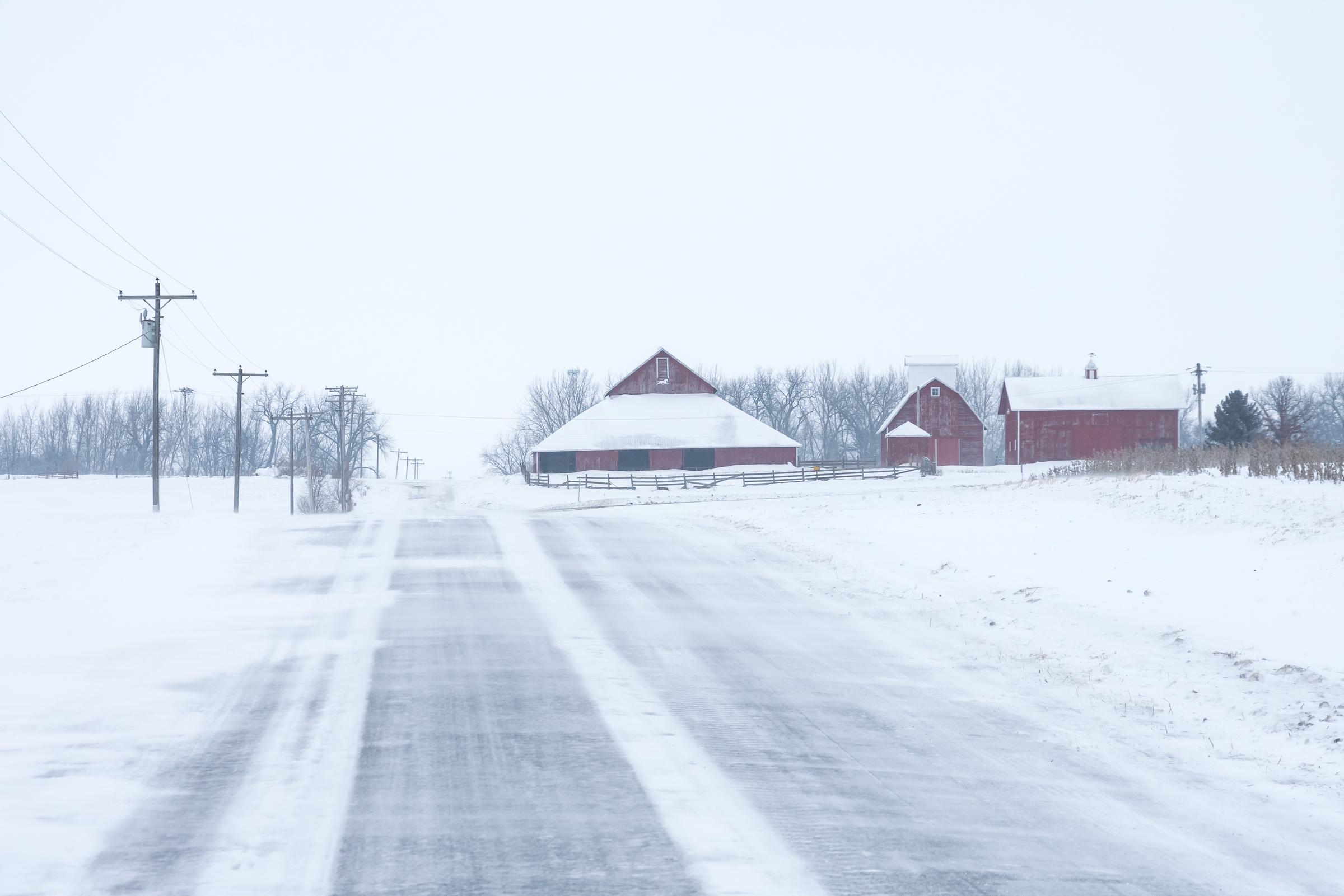 A lonely country road on a windy snowing day in Minnesota, dated March 24, 2020 | Source: Getty Images