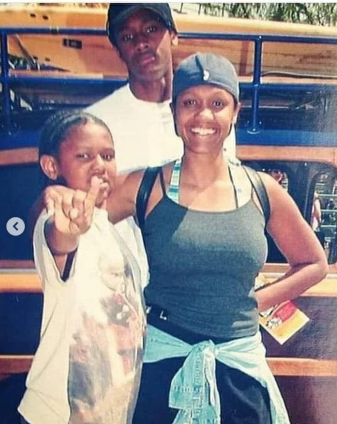 An older, brightly lit photo showing Julie, Niko, and Brian McKnight Jr., standing in front of what appears to be a bus or large vehicle, from a post dated September 28, 2025. | Source: Instagram/itsjuliemcknight