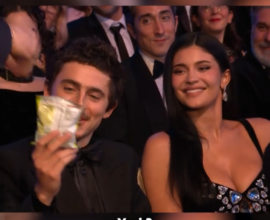 Timothée Chalament receiving a snack from Alan Cumming at the 79th BAFTA Film Awards dated February 22, 2026 | Source: TikTok/bbc