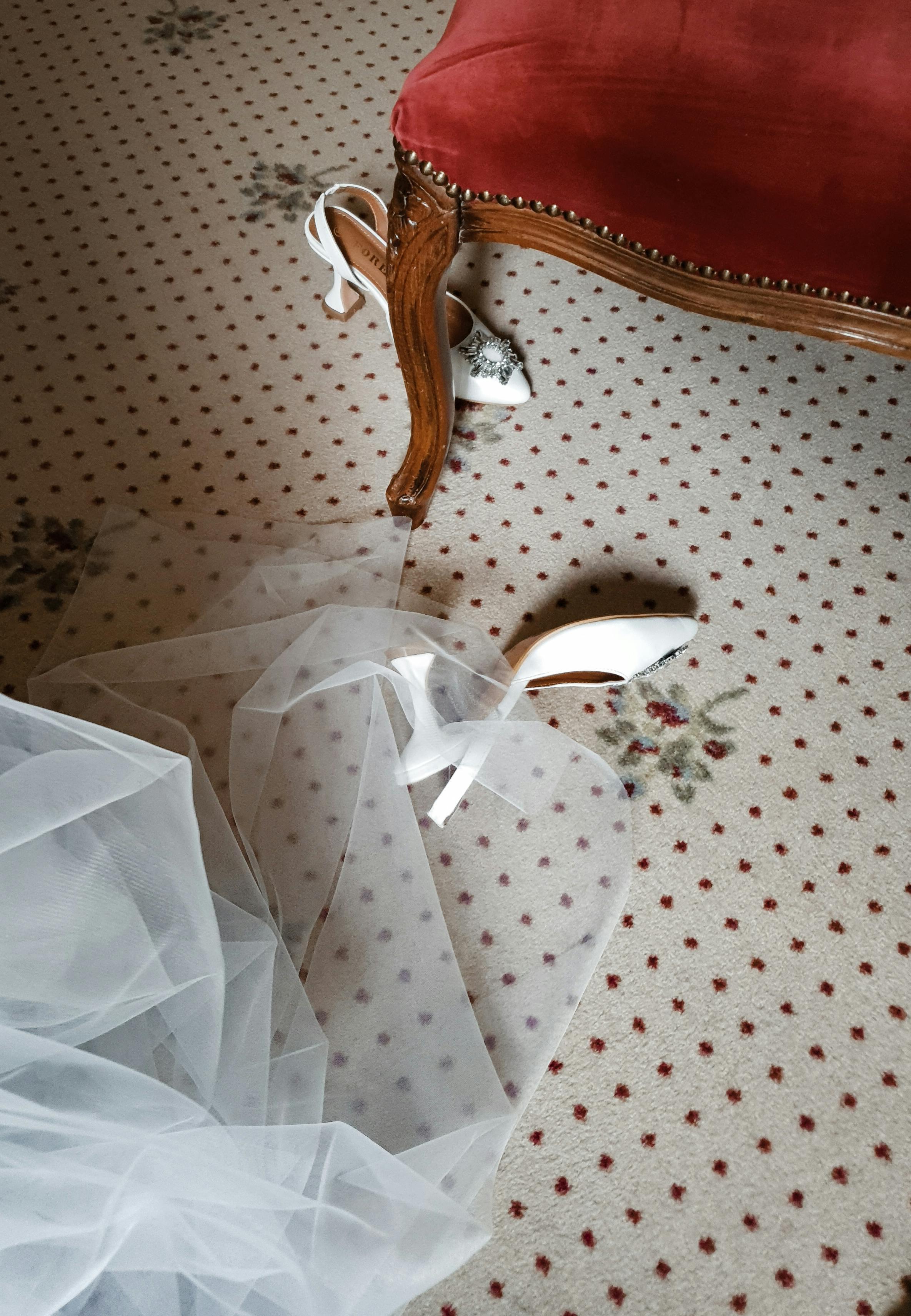 A wedding dress and shoes on the floor | Source: Pexels