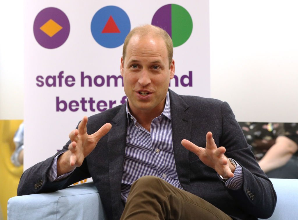 Prince William, Duke of Cambridge speaks to former and current service users during a visit to the Albert Kennedy Trust | Photo: Getty Images