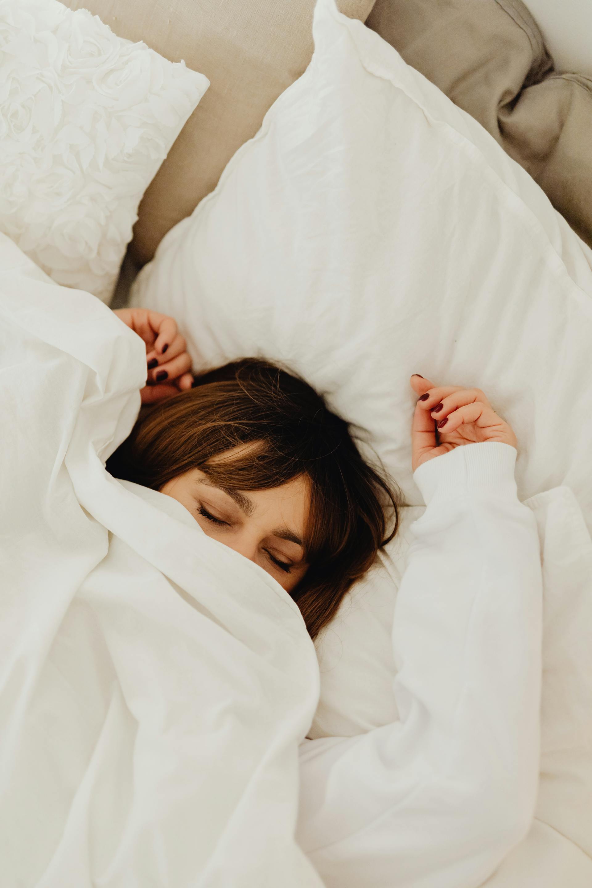 An exhausted woman lying down | Source: Pexels