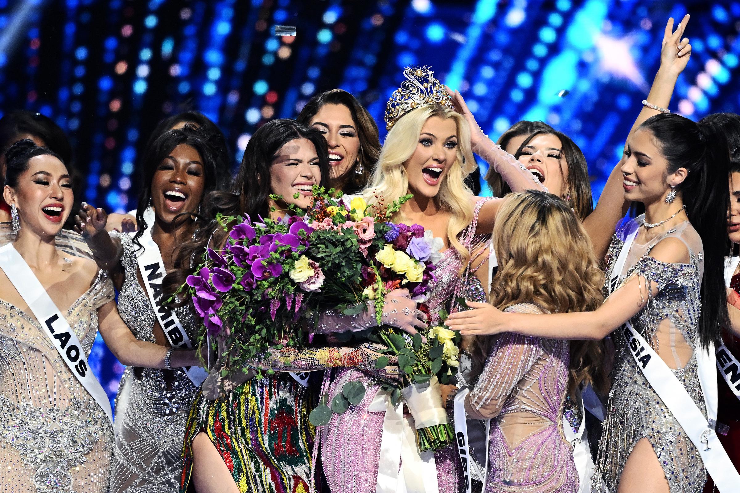 The newly crowned Miss Universe 2024, Victoria Kjaer Theilvig (C) from Denmark, reacts as she celebrates amid the other participants in Mexico City on November 16, 2024 | Source: Getty Images