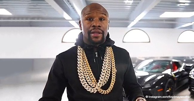 Floyd Mayweather flaunts his wealth by sipping from a gold cup while wearing diamond bling in video