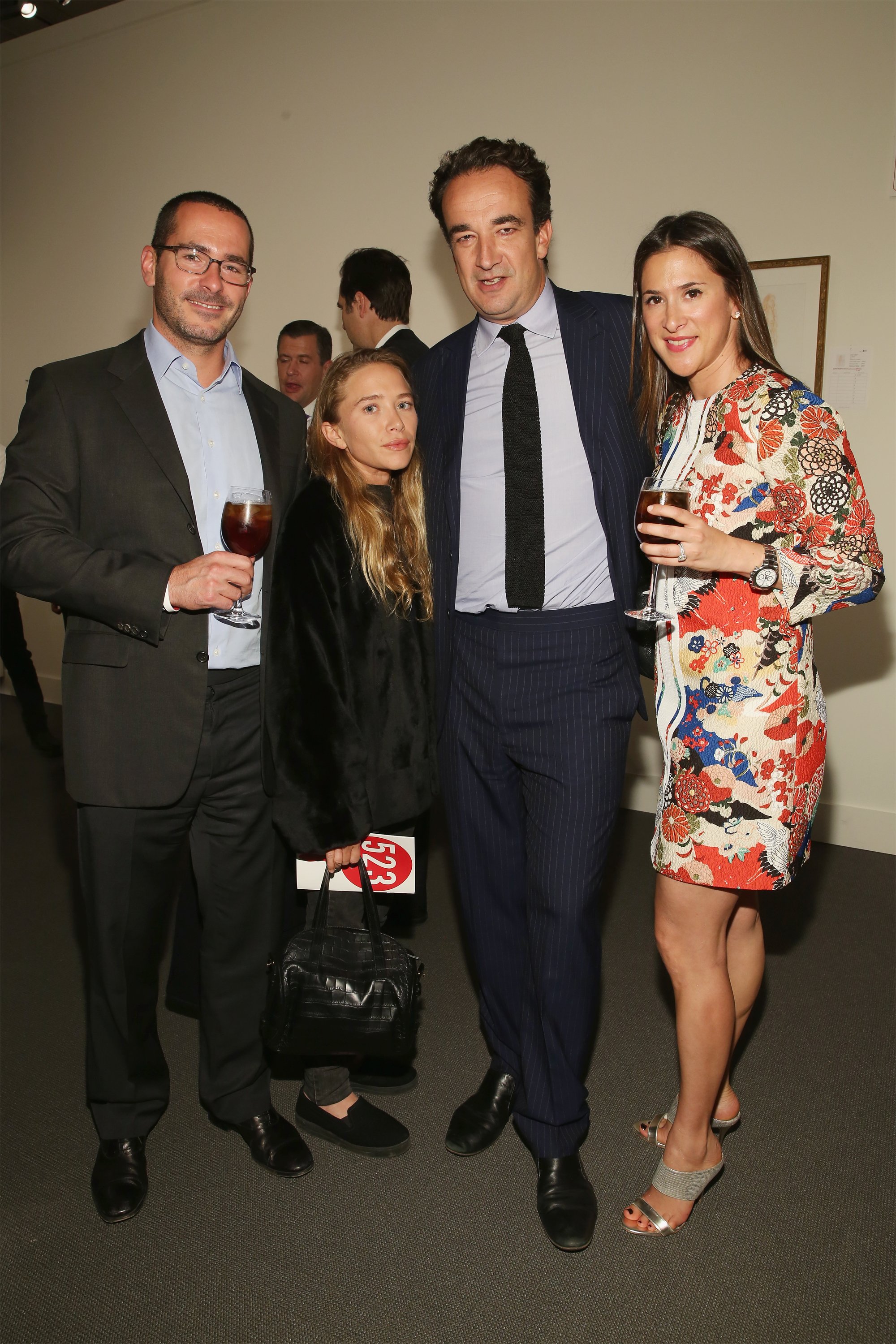 Actress Mary-Kate Olsen pictured with Olivier Sarkozy and guests during 2015 Take Home a Nude Art Auction and Party at Sotheby's on October 15, 2015 in New York City. / Source: Getty Images