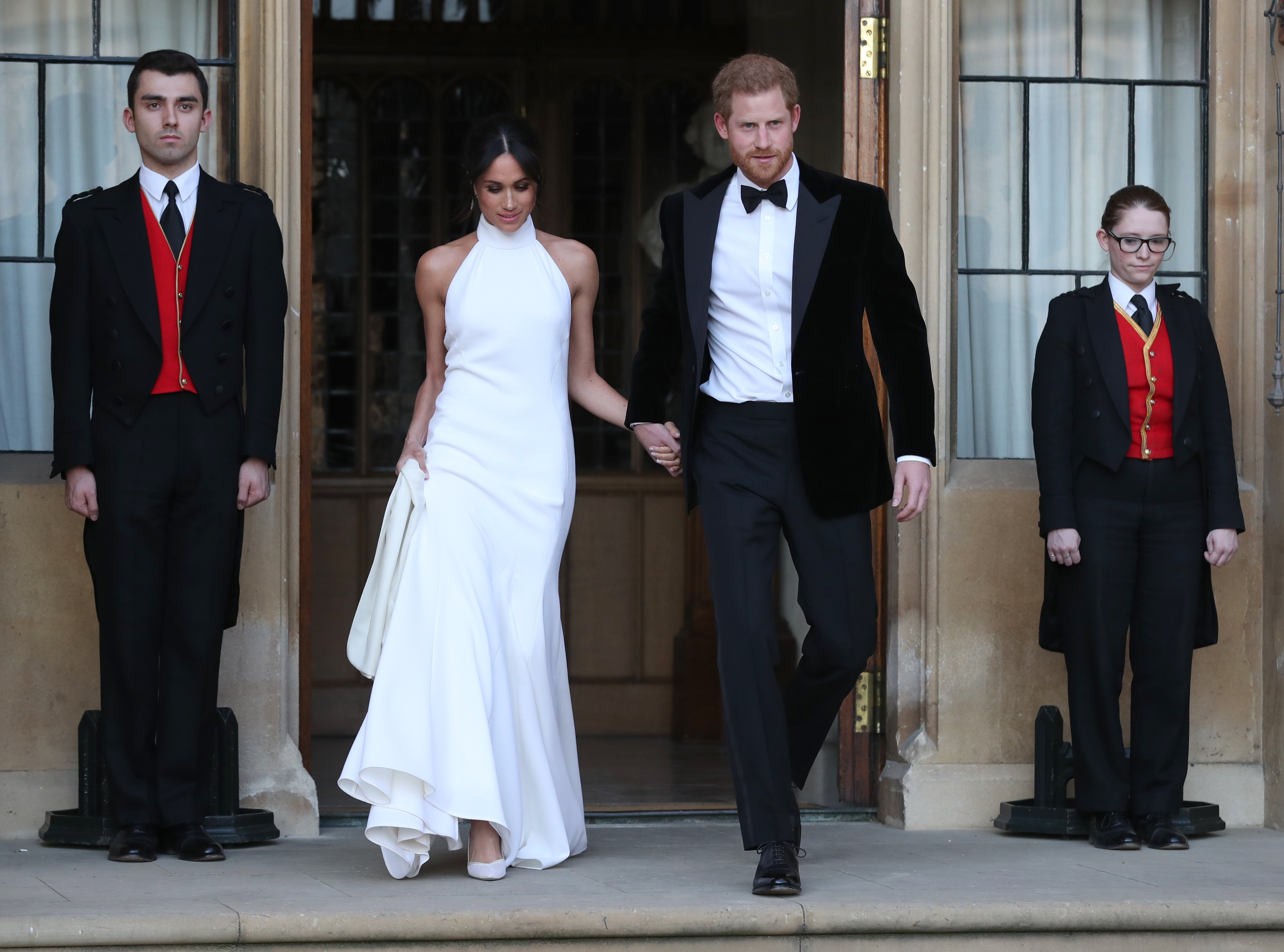 Duchess of Sussex and Prince Harry, Duke of Sussex leave Windsor Castle after their wedding to attend an evening reception at Frogmore House, hosted by the Prince of Wales on May 19, 2018| Photo: Getty Images