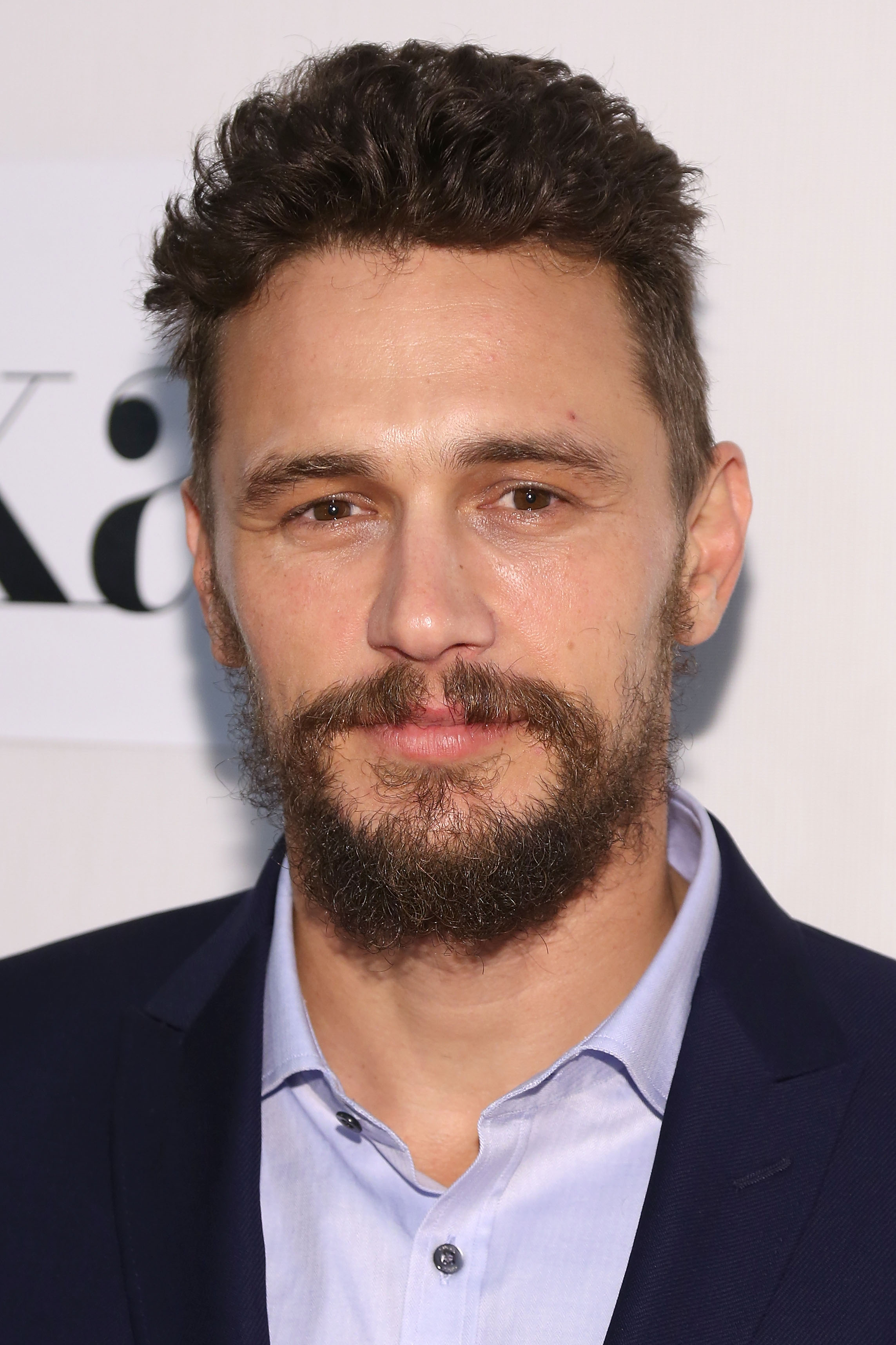 At the premiere of "The Adderall Diaries," James Franco poses with a full beard and serious gaze. His look matches the intense tone of the film, marking a shift in his on-screen roles.