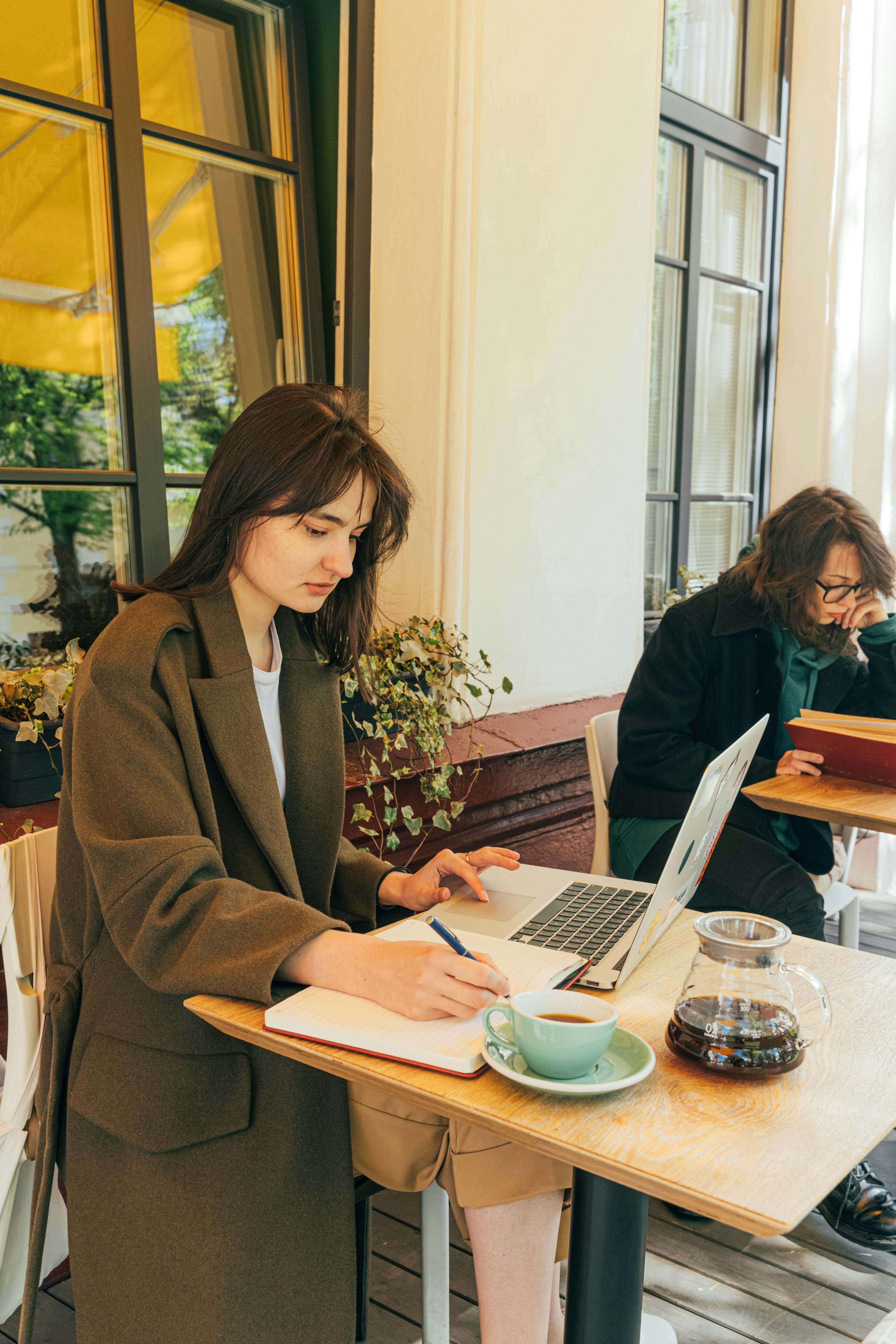 A woman working at a coffee shop | Source: Pexels