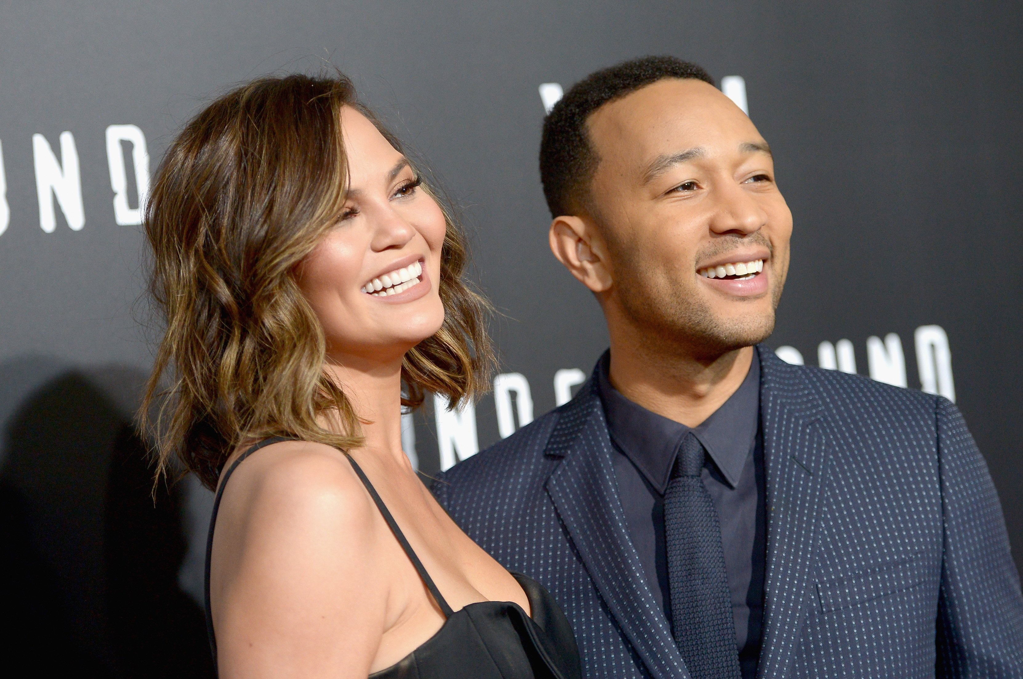 Chrissy Teigen and John Legend attending WGN America's "Underground" Season Two Premiere Screening at Regency Village Theatre on March 1, 2017 in California. | Photo by Charley Gallay/Getty Images