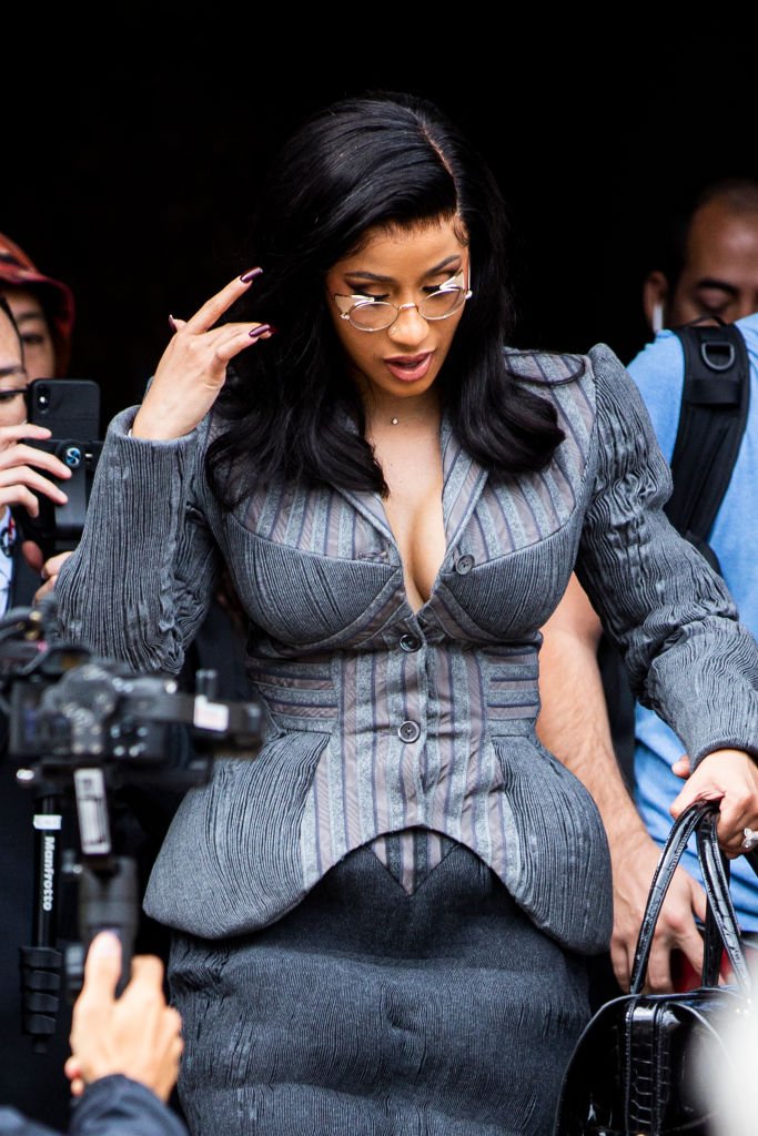 Cardi B, wearing a grey decorated blazer, is seen outside the Thom Browne show during Paris Fashion Week - Womenswear Spring Summer 2020 | Photo: GEtty Images