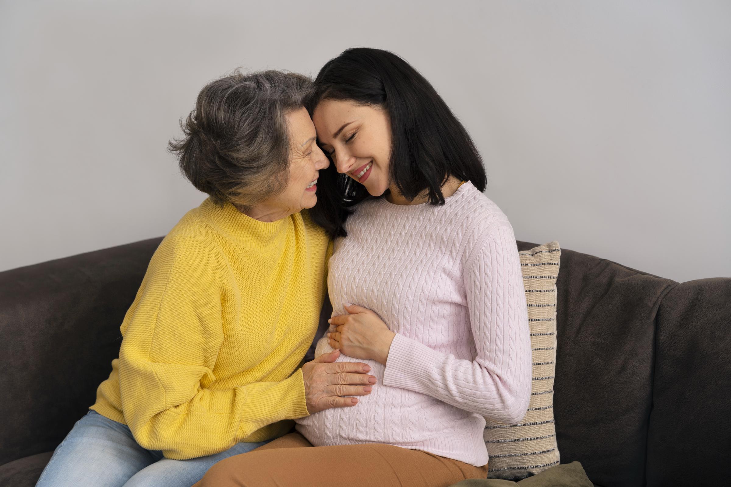 A happy elderly woman with a pregnant woman | Source: Freepik