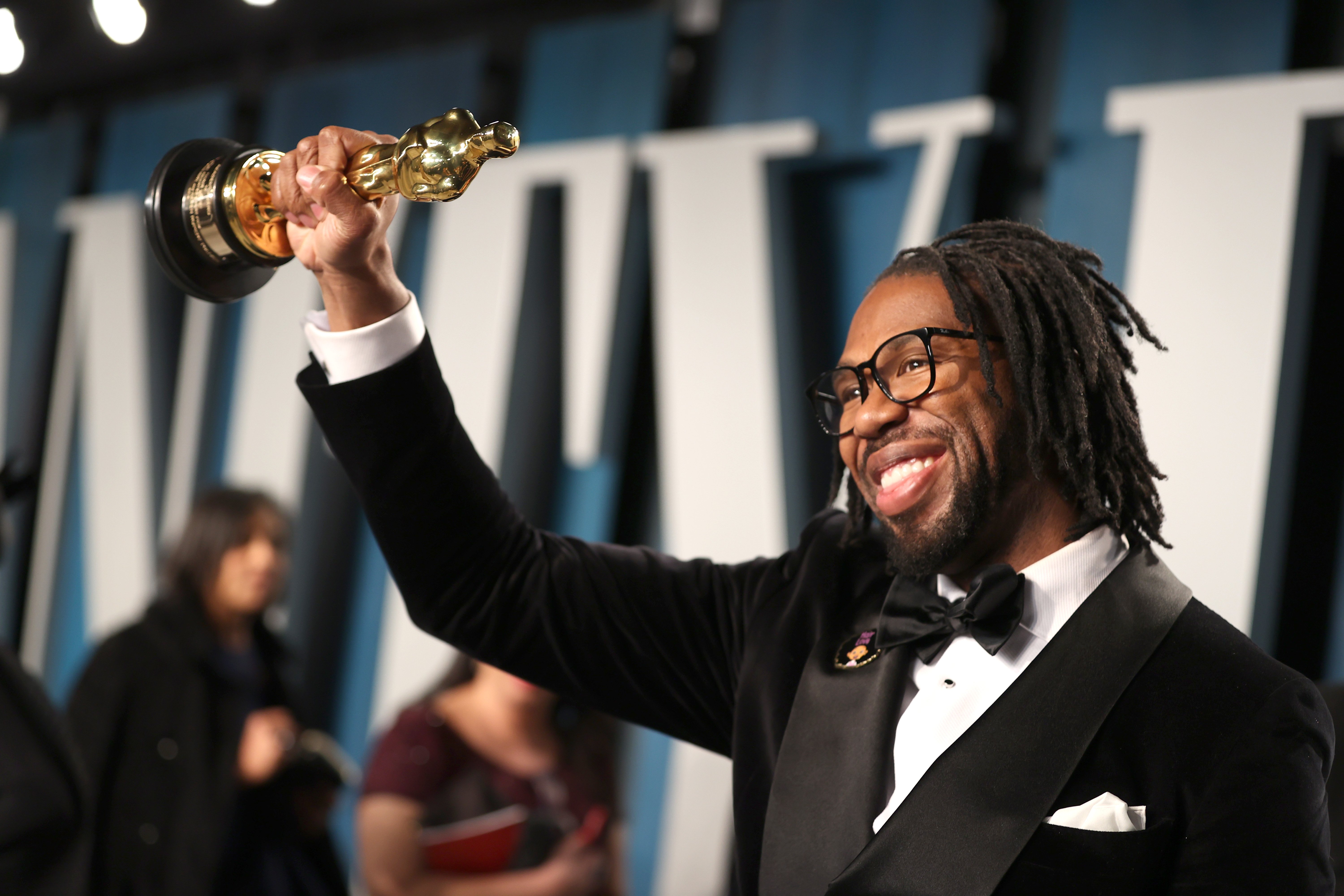 Matthew A. Cherry posed with the Oscar for Best Animated Short Film for "Hair Love" at the 2020 Vanity Fair Oscar Party. | Source: Getty Images