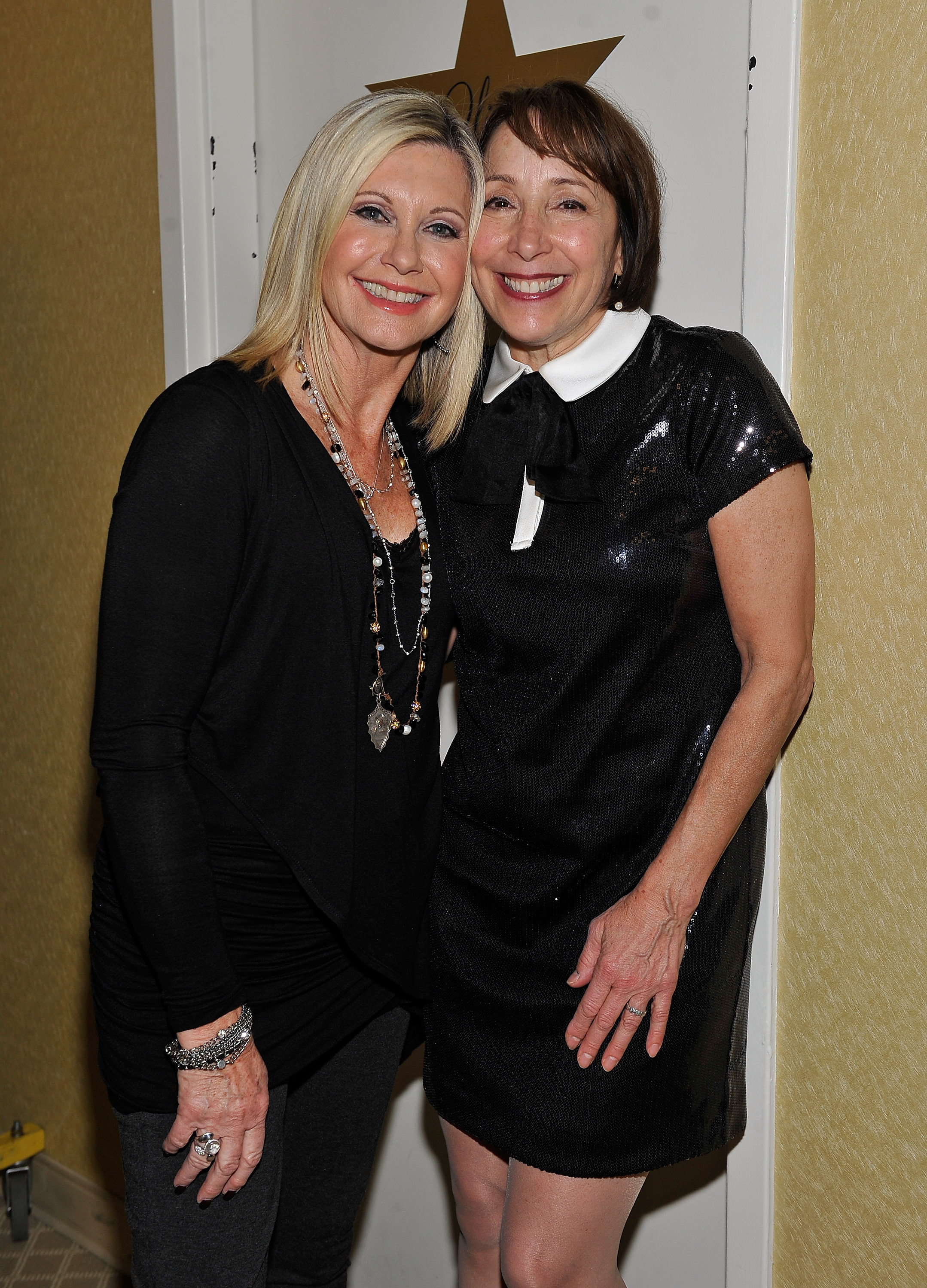 Olivia Newton-John and Didi Conn pose together after performing "Summer Nights" on January 3, 2015, in Las Vegas, Nevada. | Source: Getty Images