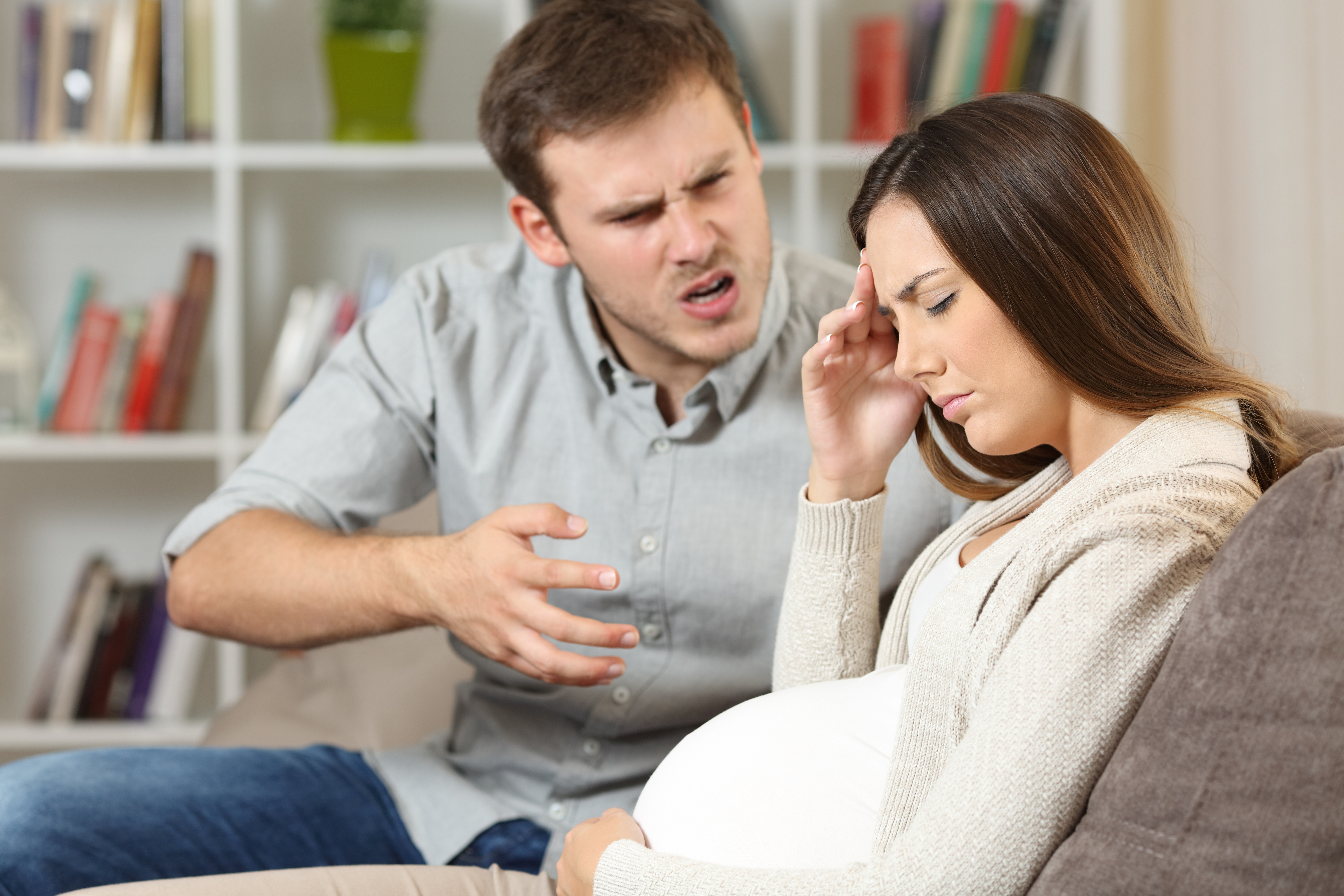 Man arguing with his sad pregnant wife | Source: Shutterstock