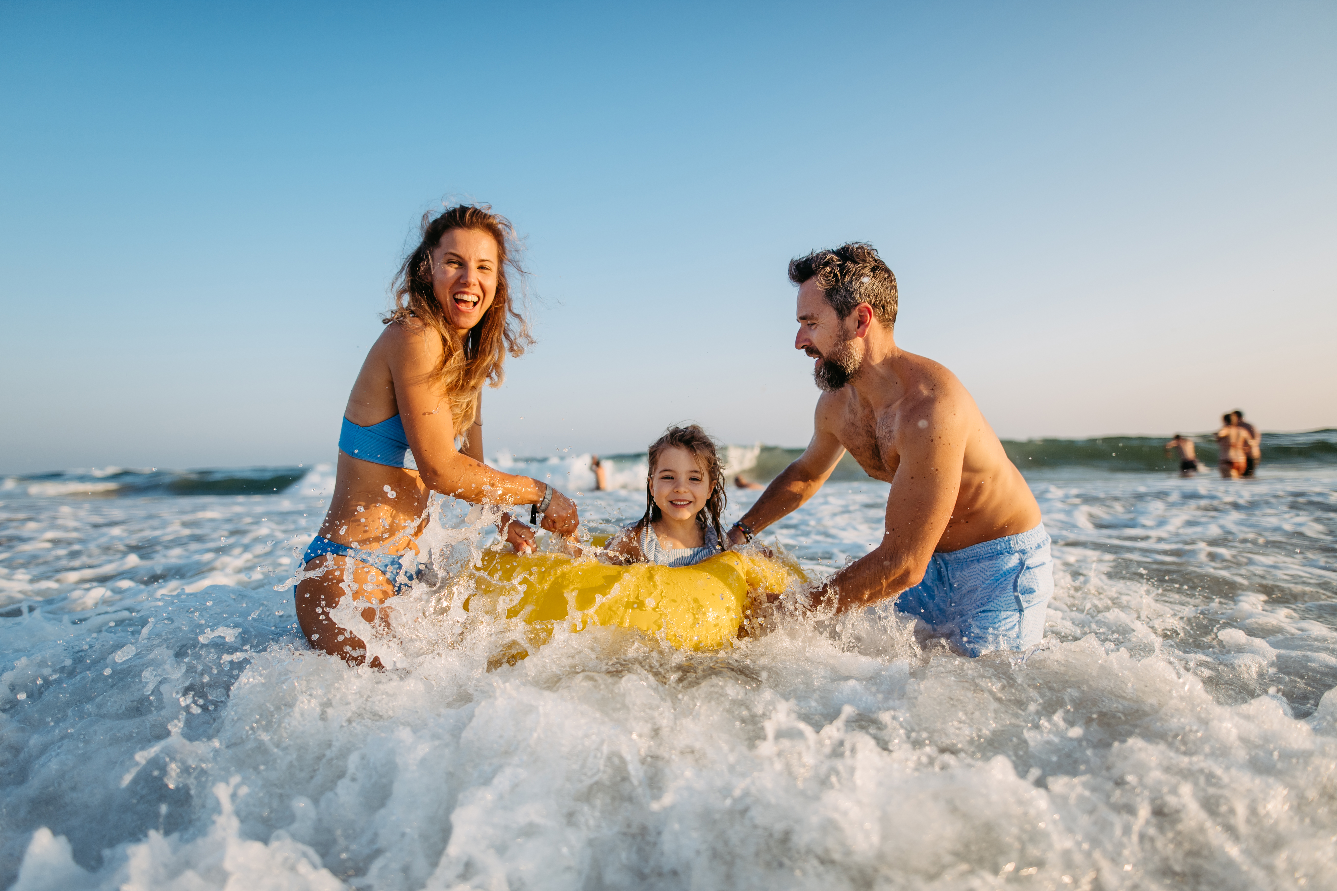 A happy family at the beach | Source: Getty Images
