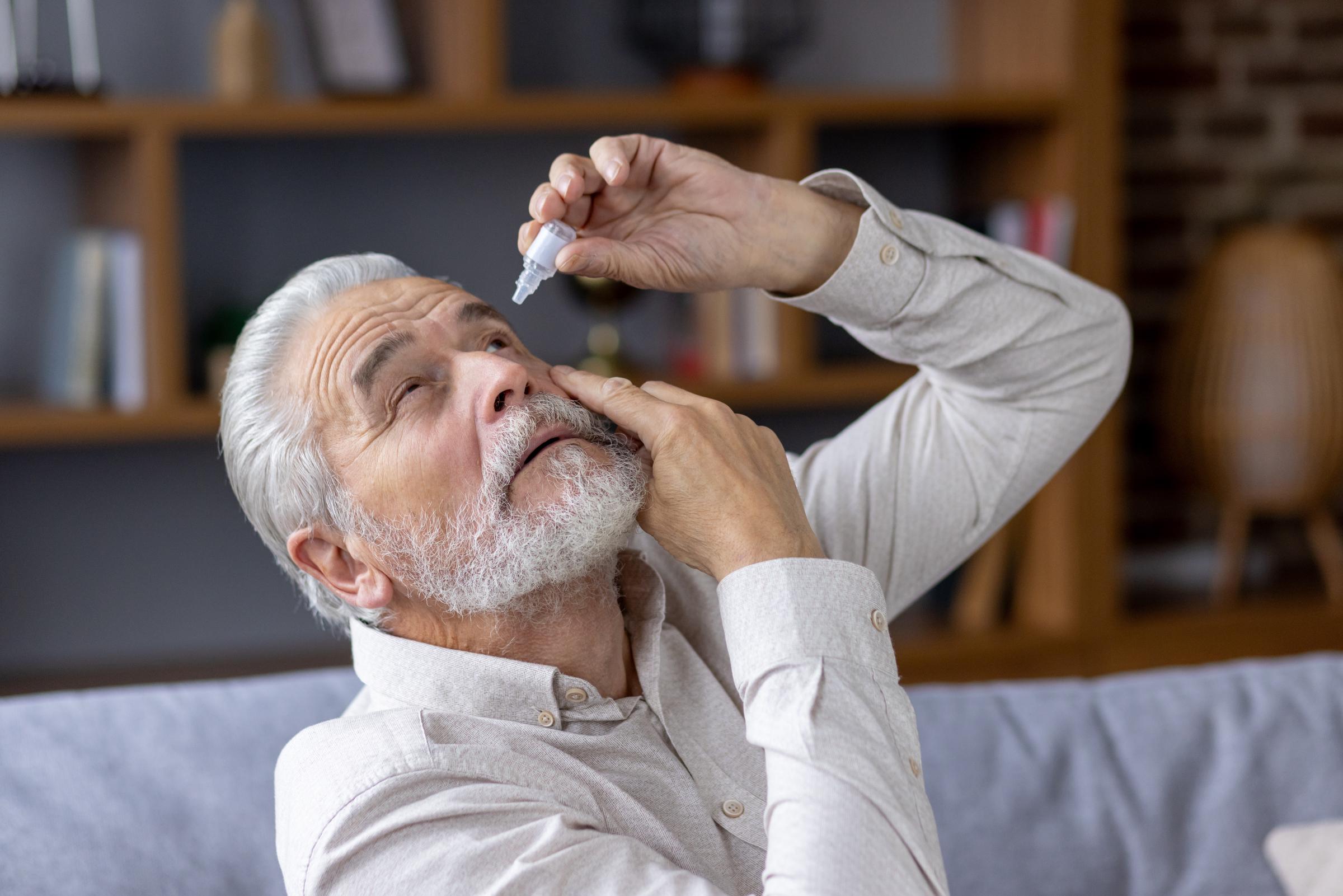 Man using eye drops | Source: Shutterstock