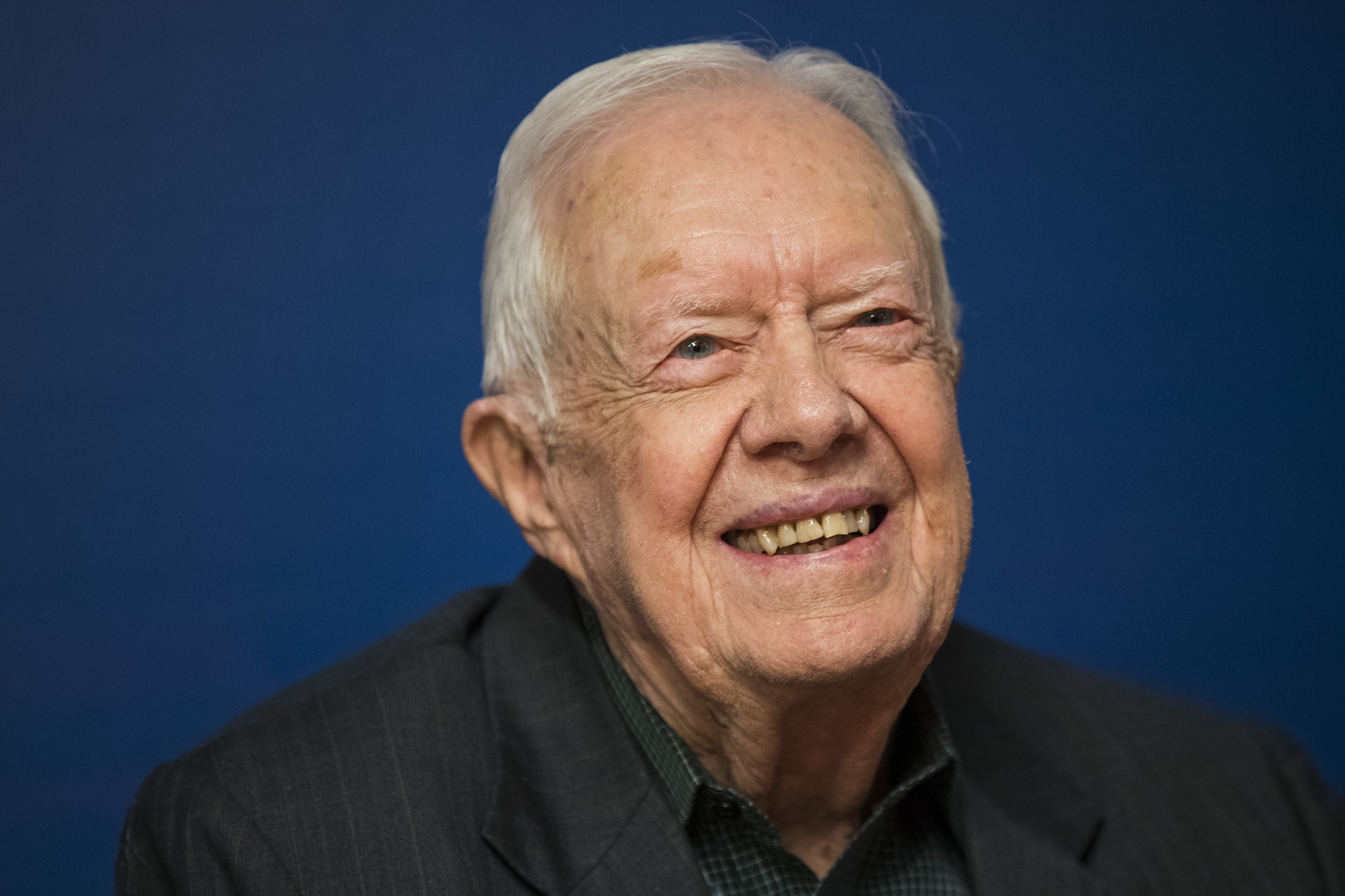 Jimmy Carter smiles during a book signing event for his new book 'Faith: A Journey For All' at Barnes & Noble bookstore in Midtown Manhattan, March 26, 2018, in New York City. | Source: Getty Images.