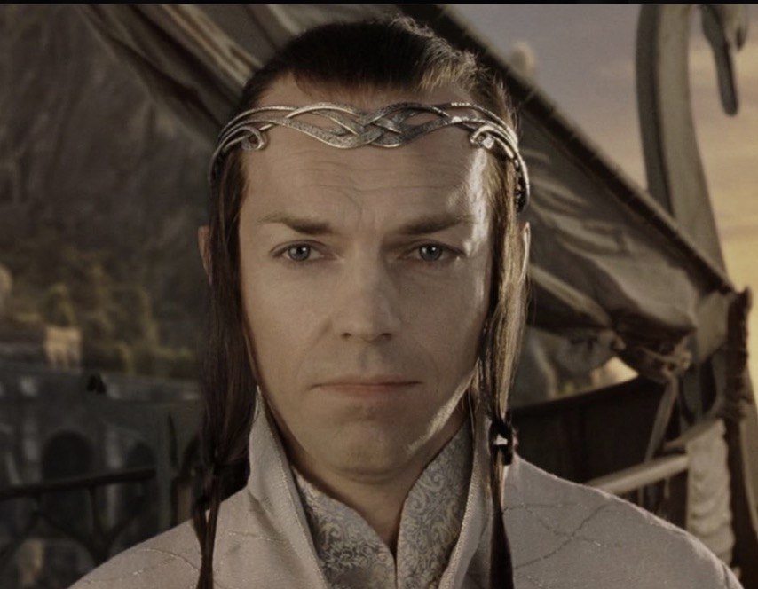 In "The Fellowship of the Ring," Hugo Weaving portrayed Elrond, the ancient and wise Lord of Rivendell who held the weight of ages in his gaze. With his ceremonial robes, silver circlet and restrained poise, Weaving gave Elrond both elegance and inner strength — a leader torn between duty and history. | Source: The Fellowship of the Ring