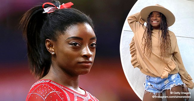 Simone Biles Flashes a White Smile Posing in Shorts with a 