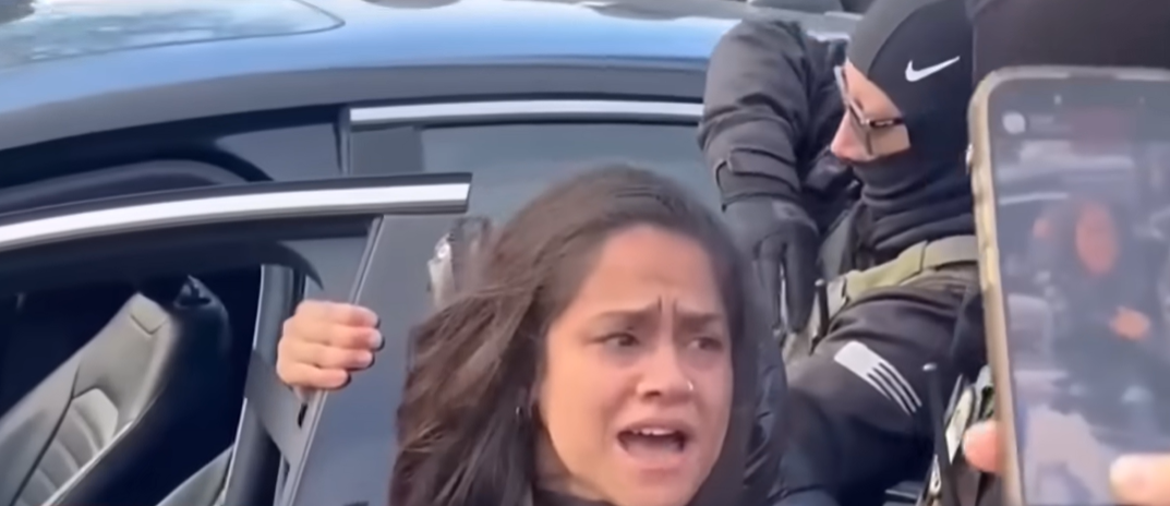 Aliya Rahman being dragged out of her car as seen in a video posted on January 20, 2026 | Source: YouTube/CNN