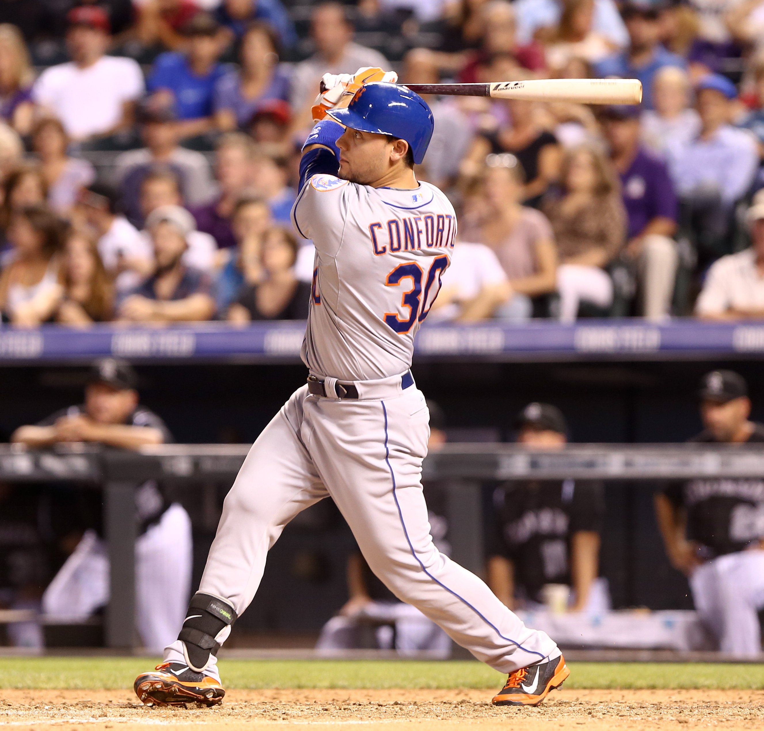 Michael Conforto swings at a pitch during a game against the Colorado Rockies at Coors Field on August 21, 2015 | Photo: Shutterstock