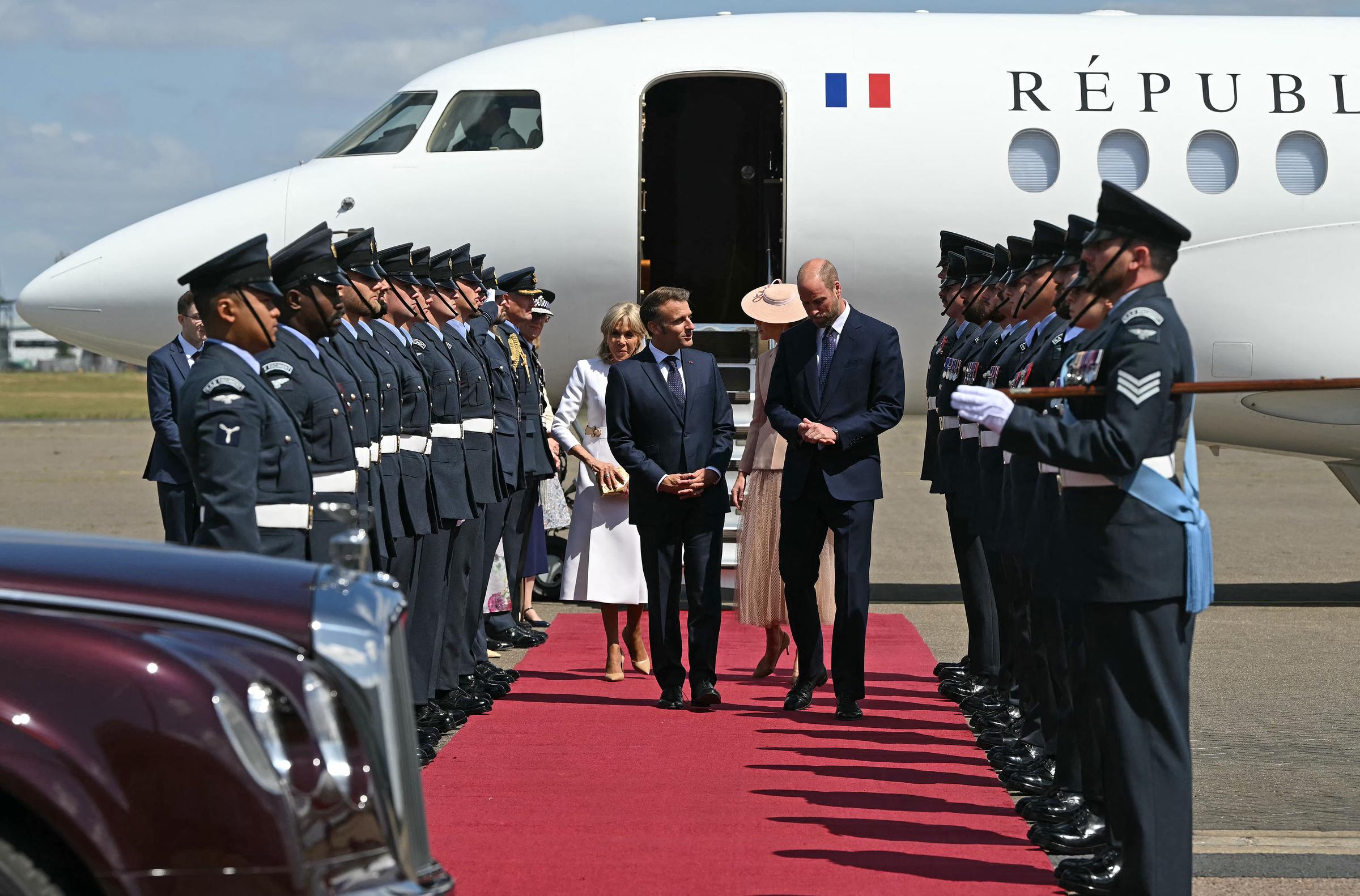 William, Prince of Wales, and Catherine, Princess of Wales, welcoming Emmanuel and Brigitte Macron upon their arrival at RAF Northolt on July 8, 2025. | Source: Getty Images