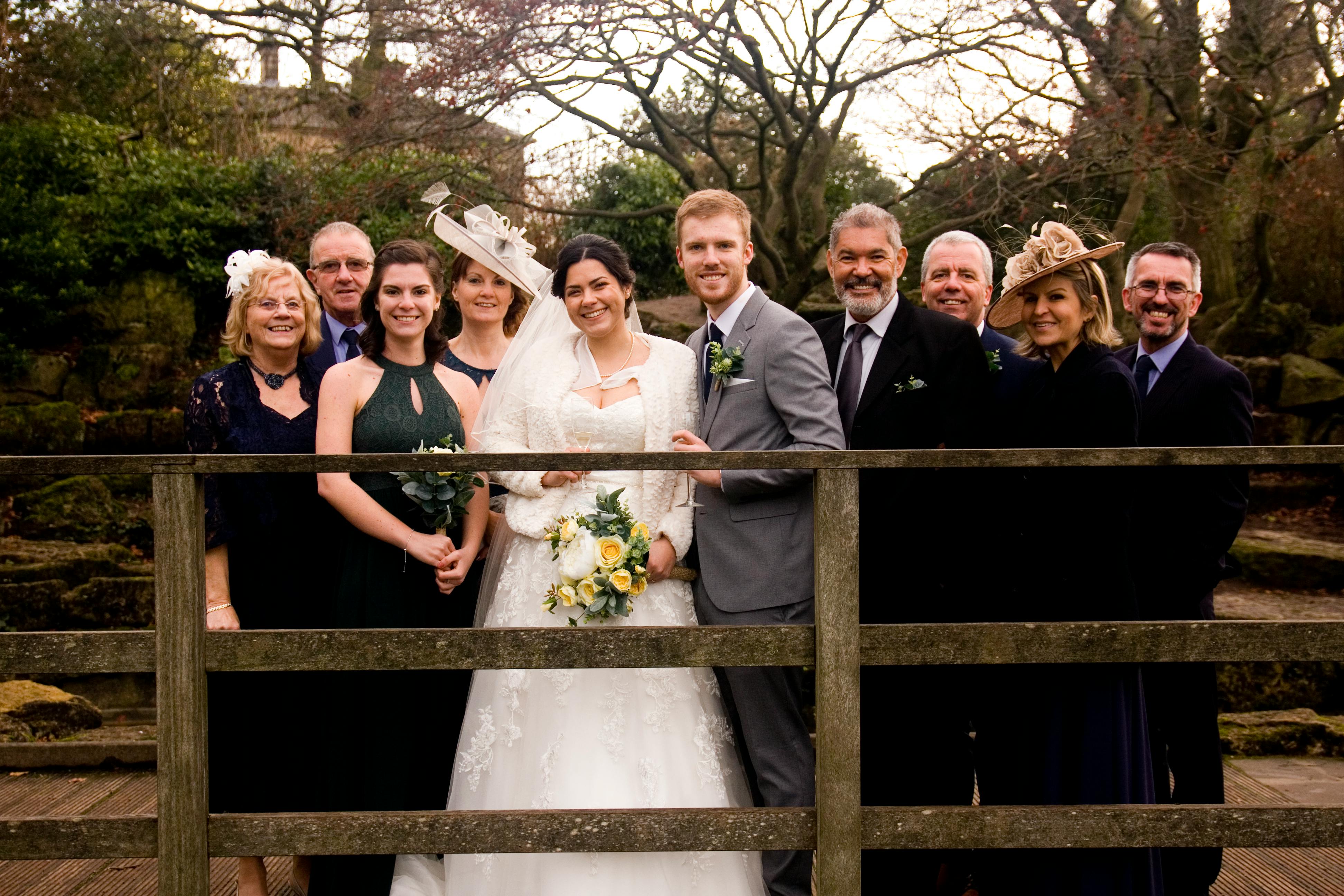 A family poses for a wedding photograph | Source: Pexels