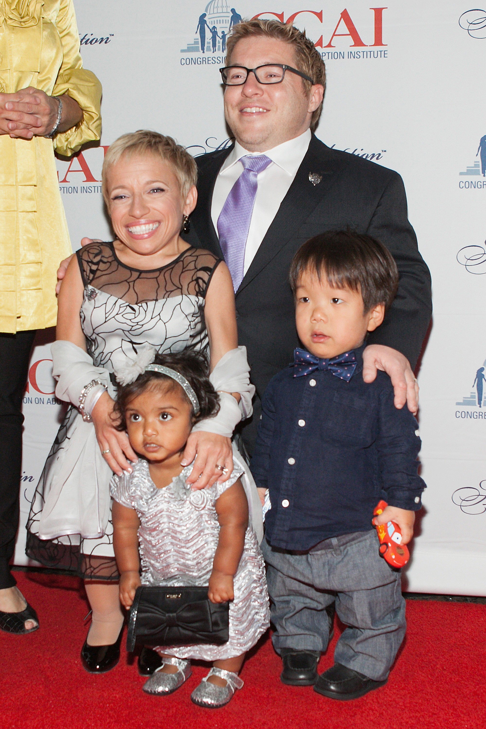 Becky Weichhand, Mark Walberg, Bill Klein, Jen Arnold with daughter Zoey, Sen. Mary Landrieu, and Jack Gerard attend the 2014 Angels In Adoption Gala in Washington, DC on September 17, 2014 | Photo: Getty Images