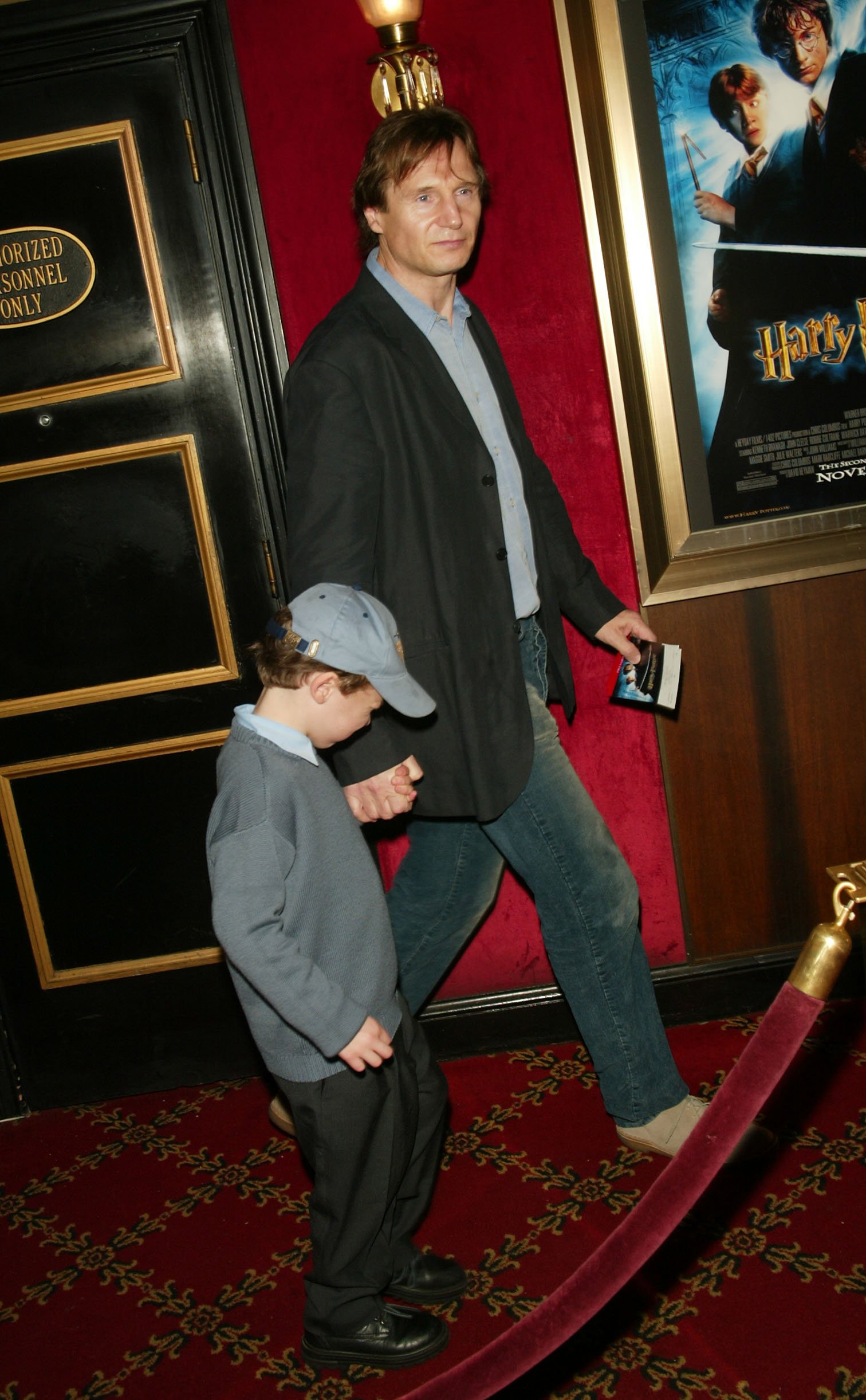 Liam Neeson with son attending the N.Y. Premiere of Warner Bros. "Harry Potter and the Chamber of Secrets" at the Ziegfeld Theatre in New York City. November 10, 2002 | Source: Getty Images 