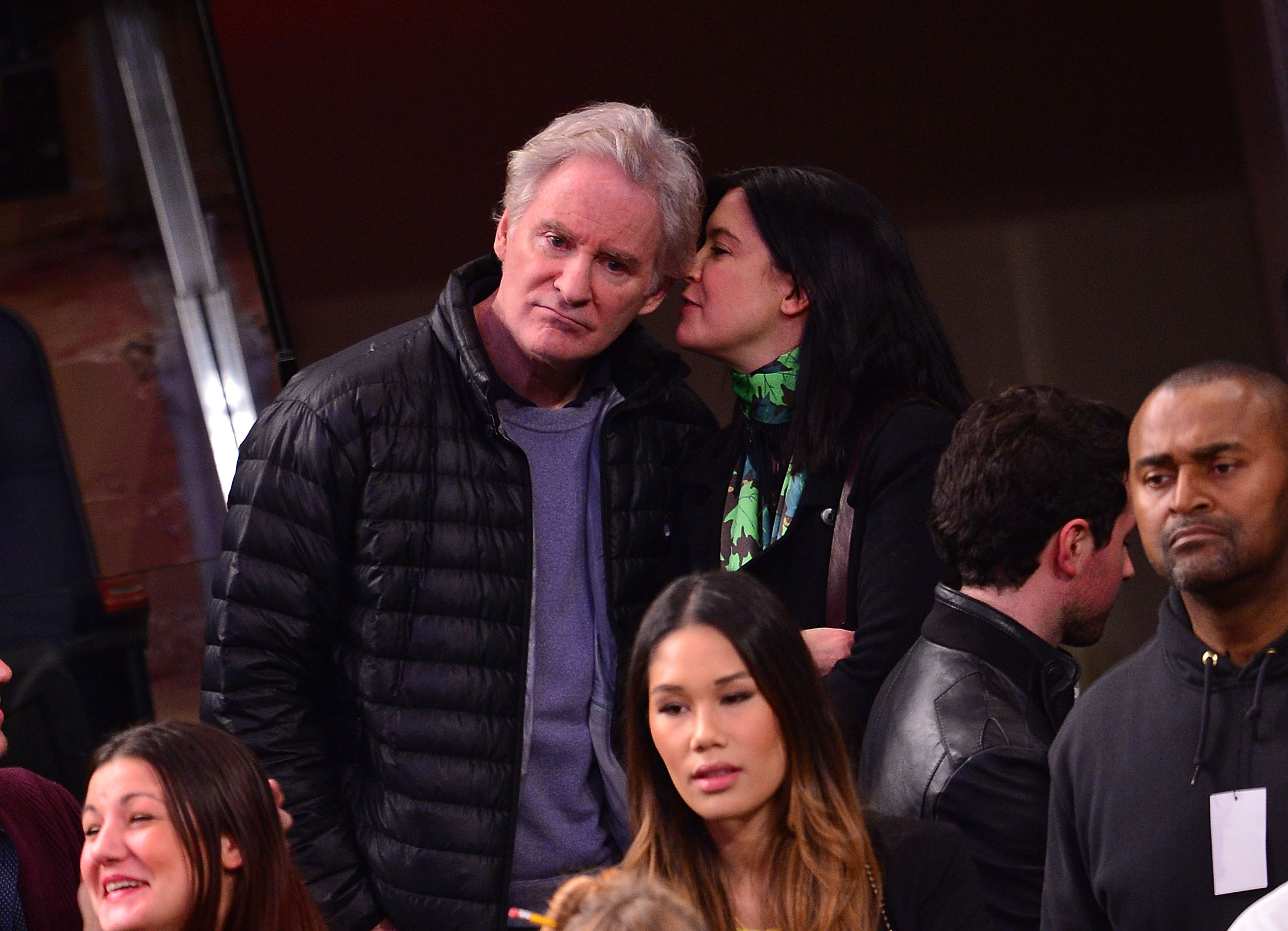 Kevin Kline and Phoebe Cates at Madison Square Garden on January 13, 2014, in New York City | Source: Getty Images