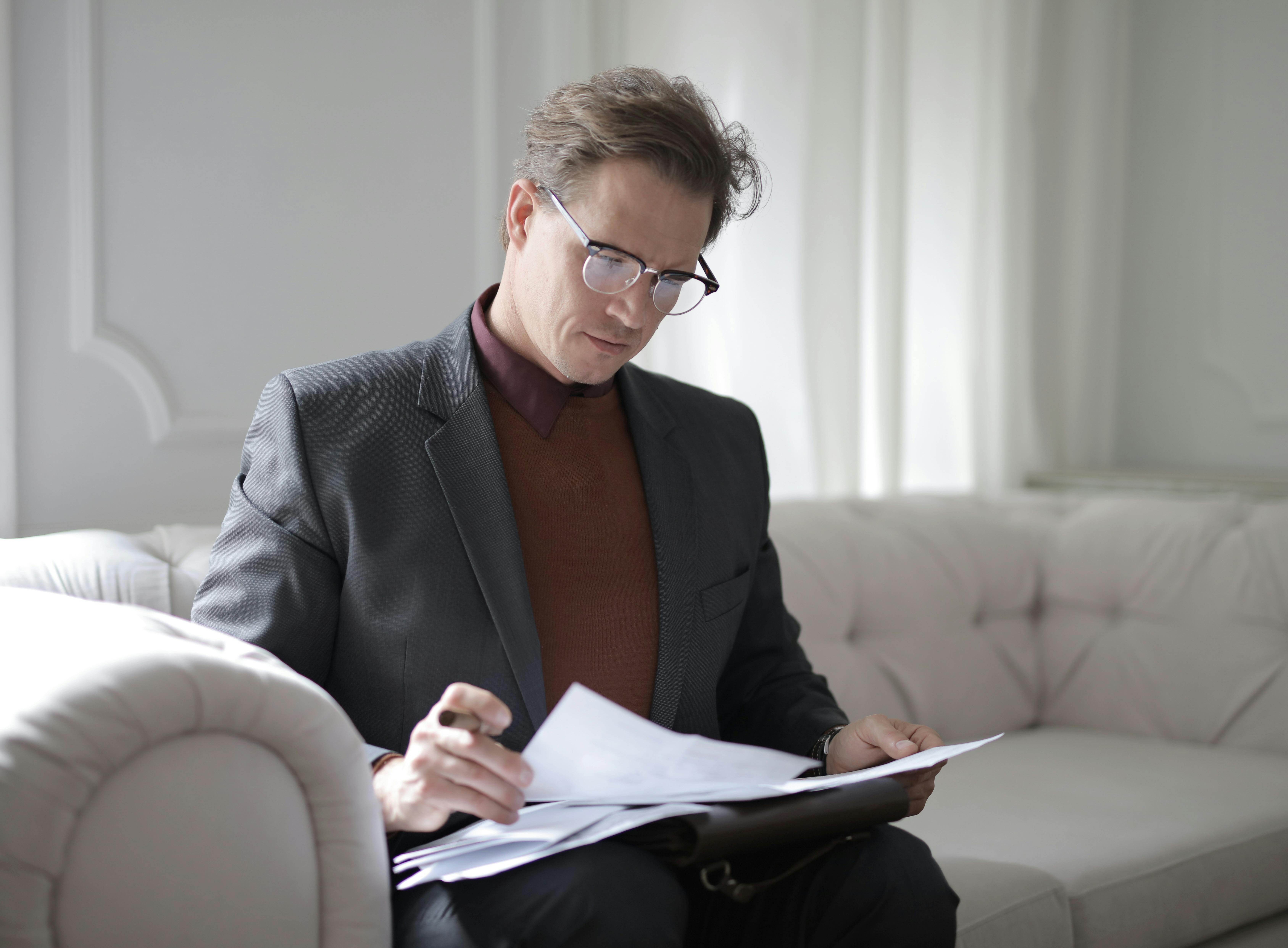 A lawyer looking at the papers | Source: Pexels