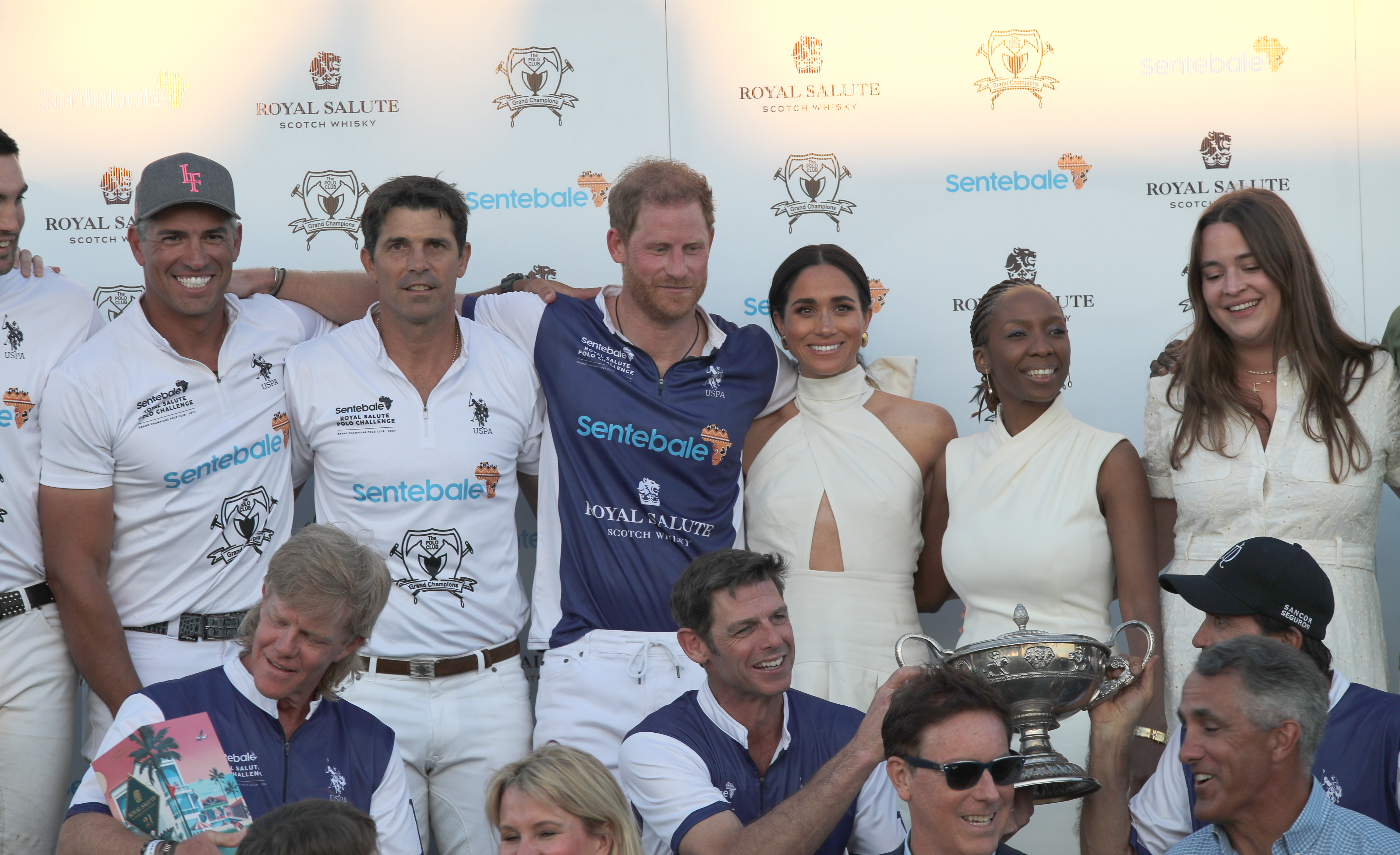 Meghan Markle, The Duchess of Sussex, and Prince Harry, the Duke of Sussex pose for pictures with the teams after he took part in the Royal Salute Polo Challenge, to benefit Sentebale, in Wellington, Florida, on April 12, 2024. | Source: Getty Images