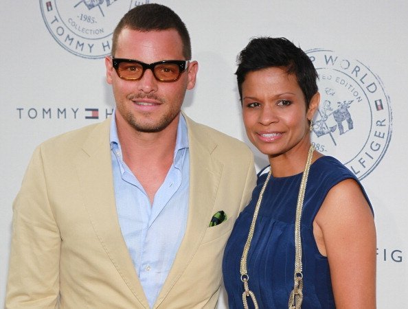 Actor Justin Chambers (L) and wife Keisha Chambers attend the launch party for Tommy Hilfiger's "Prep World Pop Up House" at The Grove | Photo: David Livingston/Getty Images