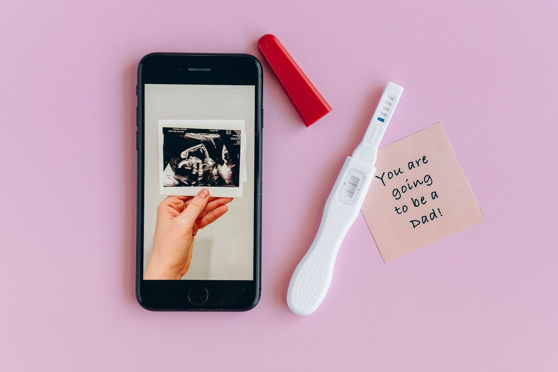 Positive pregnancy test and sonogram. | Source: Pexels