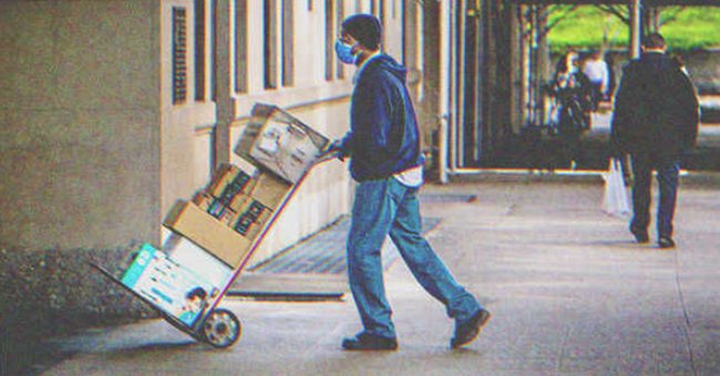 A man delivering a bunch of packages | Source: Shutterstock