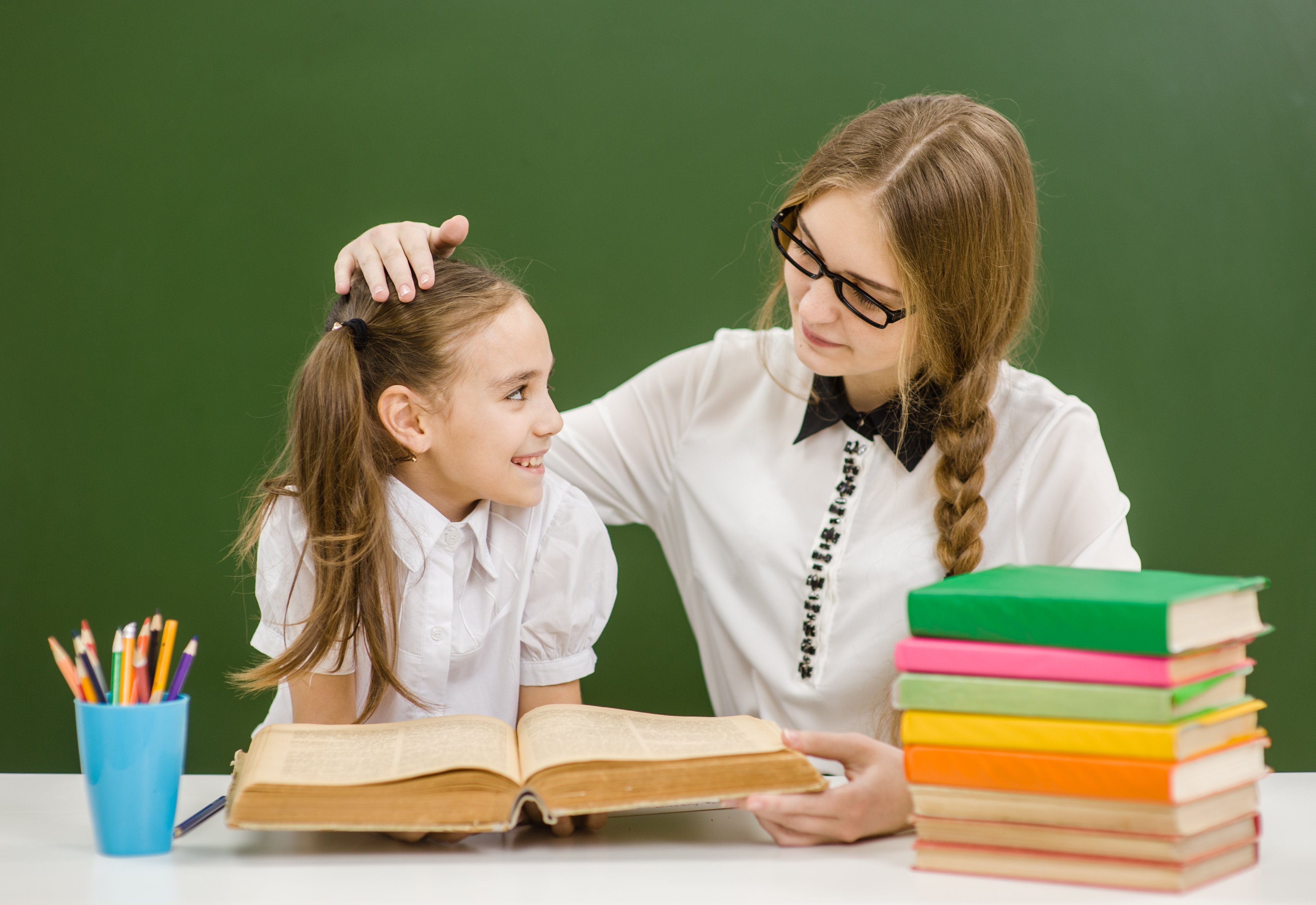 Teacher and student in classroom. | Photo: Shutterstock