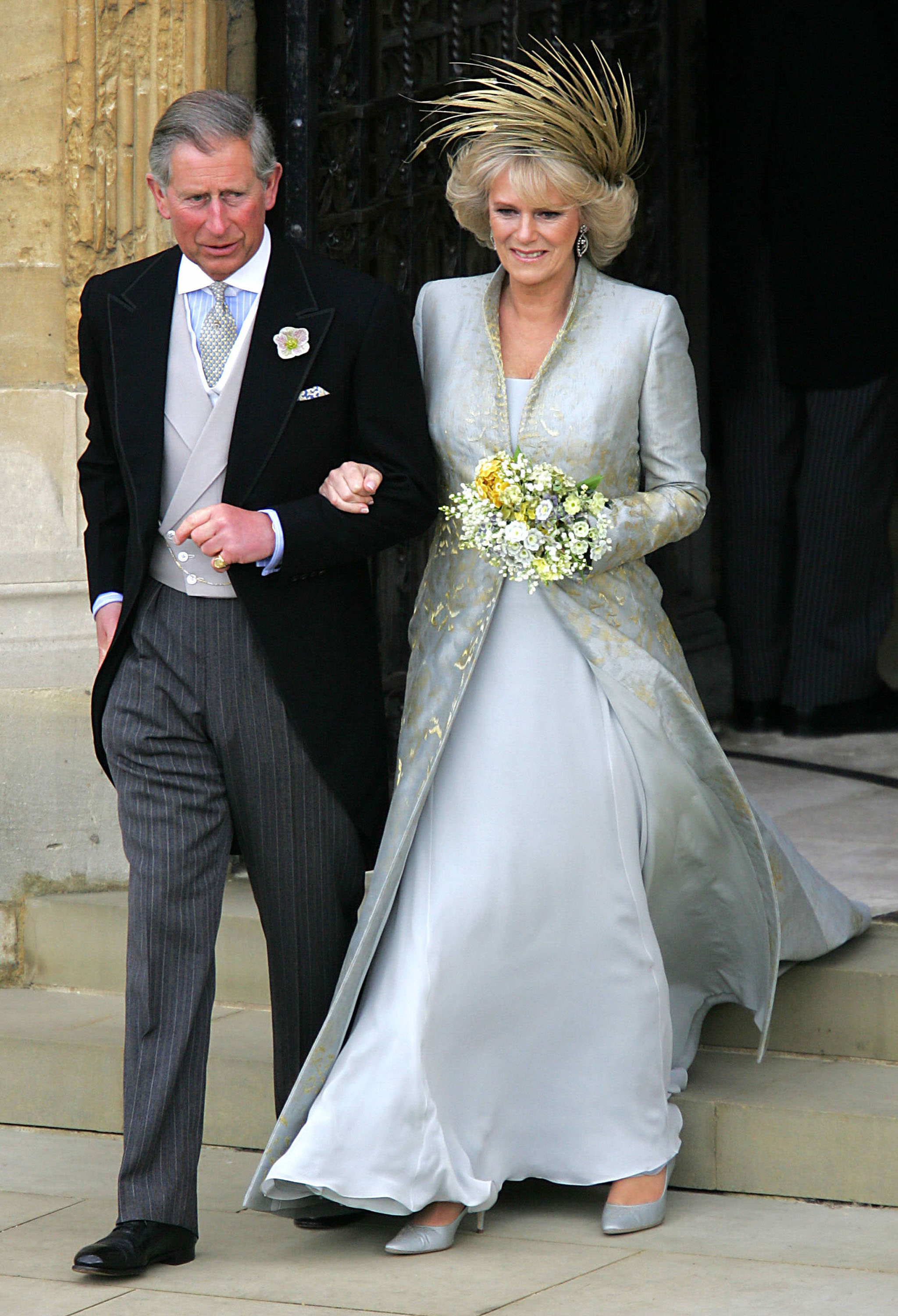 Prince Charles, the Prince of Wales and Camilla, the Duchess Of Cornwall, leave the Service of Prayer and Dedication following their marriage at Windsor Castle in Berkshire, England, on April 9, 2005. | Source: Getty Images