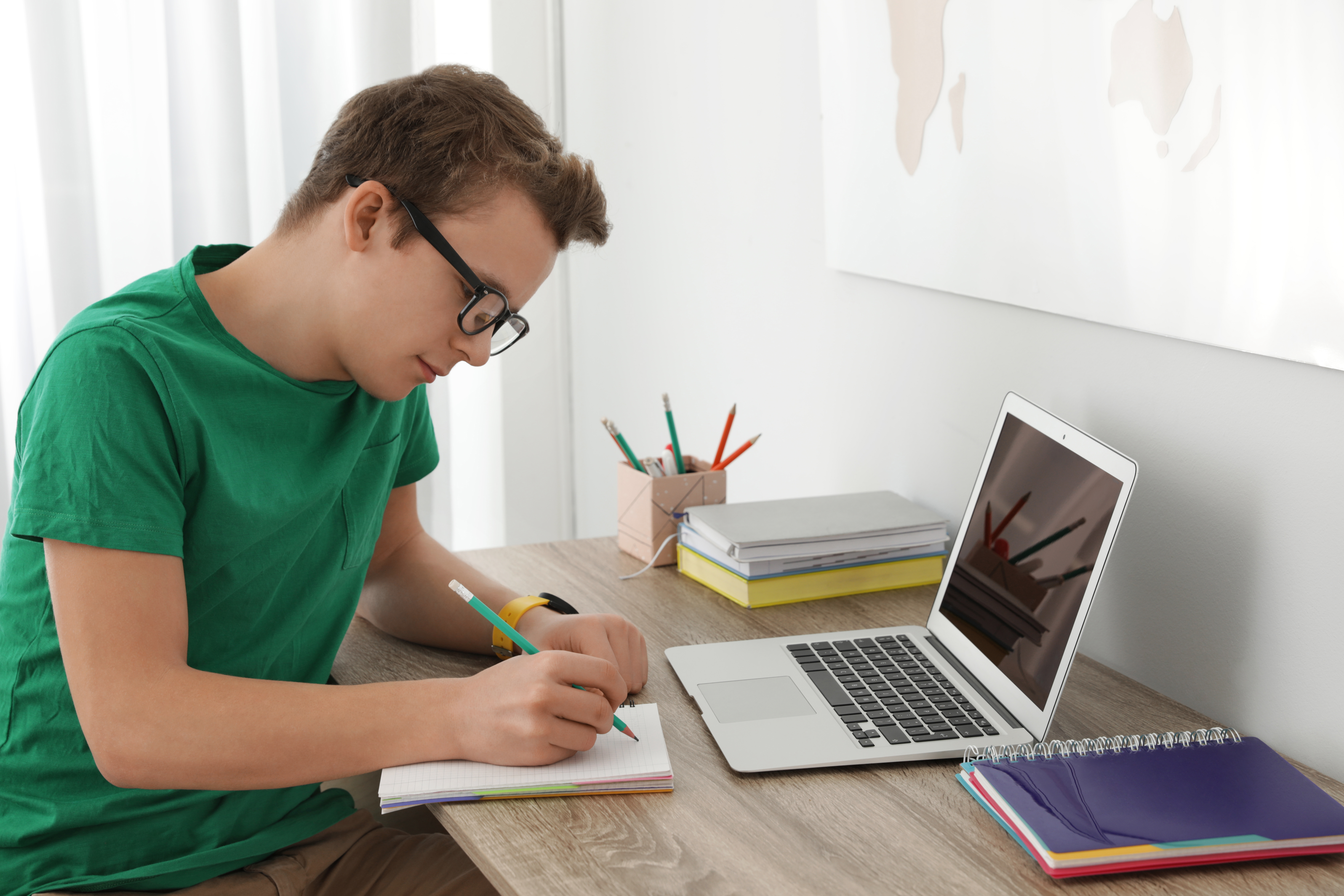 A boy doing his homework | Source: Shutterstock