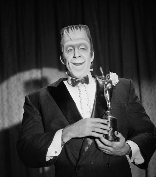 Herman Munster with an award trophy in a still from the CBS television situation comedy 'The Munsters' | Photo: Getty Images