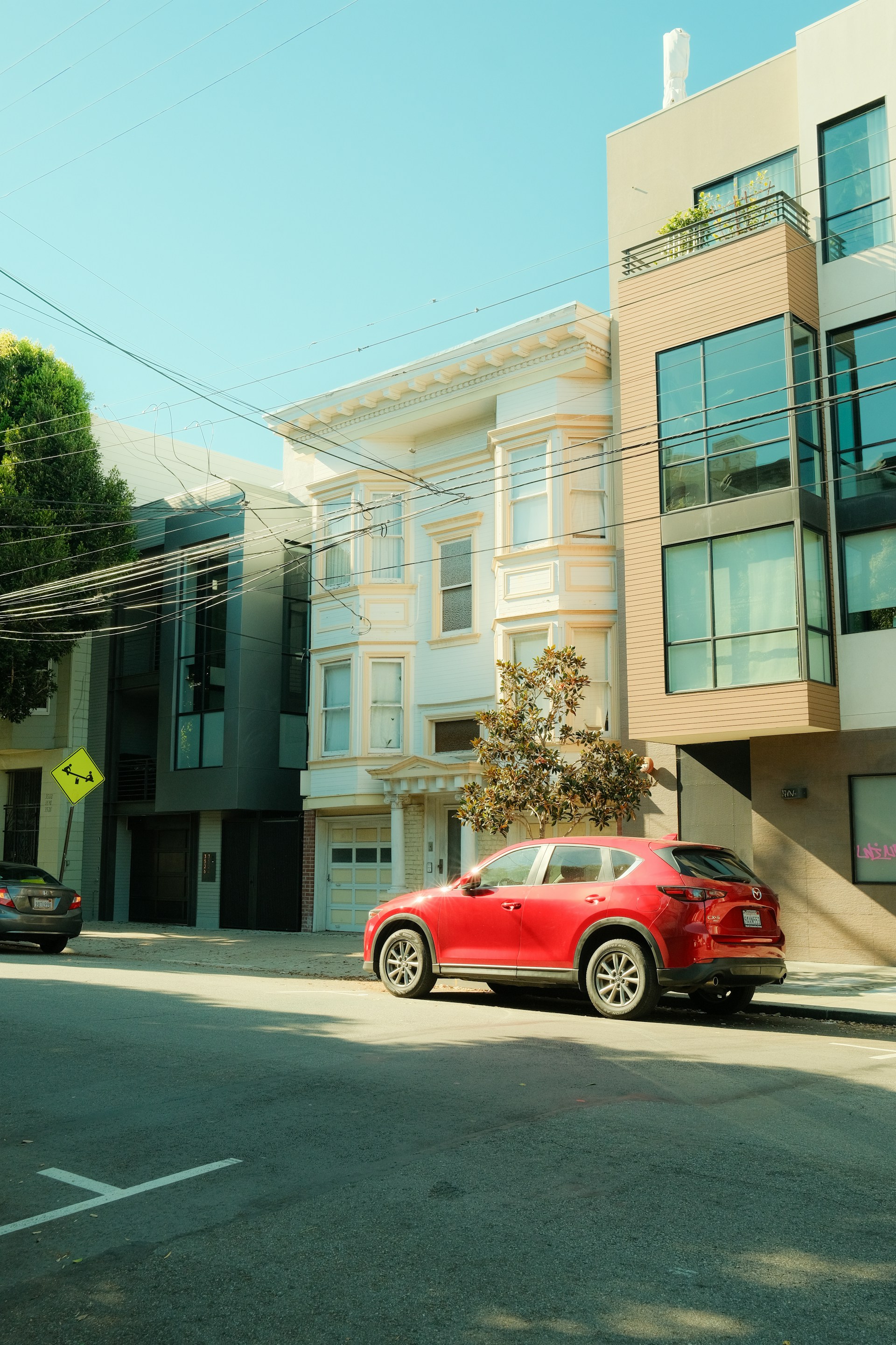 A red car in a neighborhood | Source: Unsplash