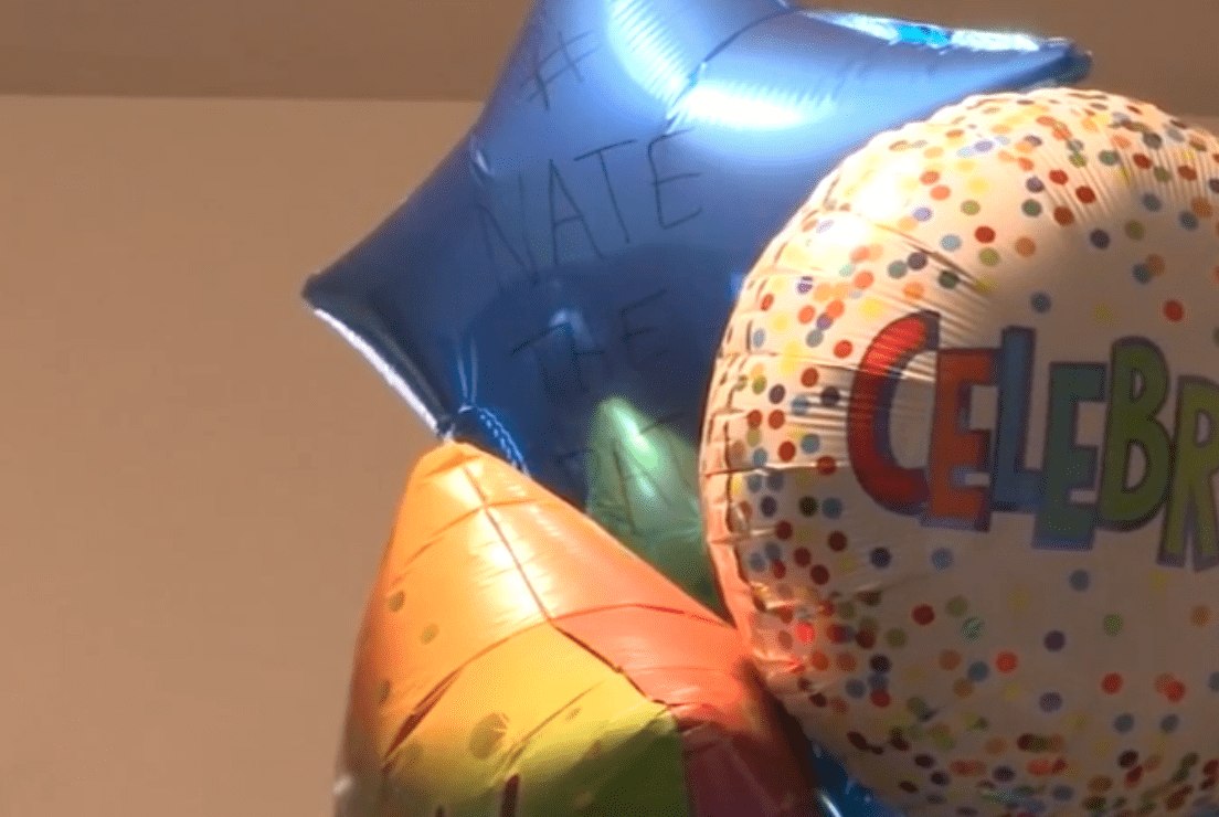 Ballons welcome Nate to his forever home, one of them is labelled "Nate the Great" | Photo: ABC7
