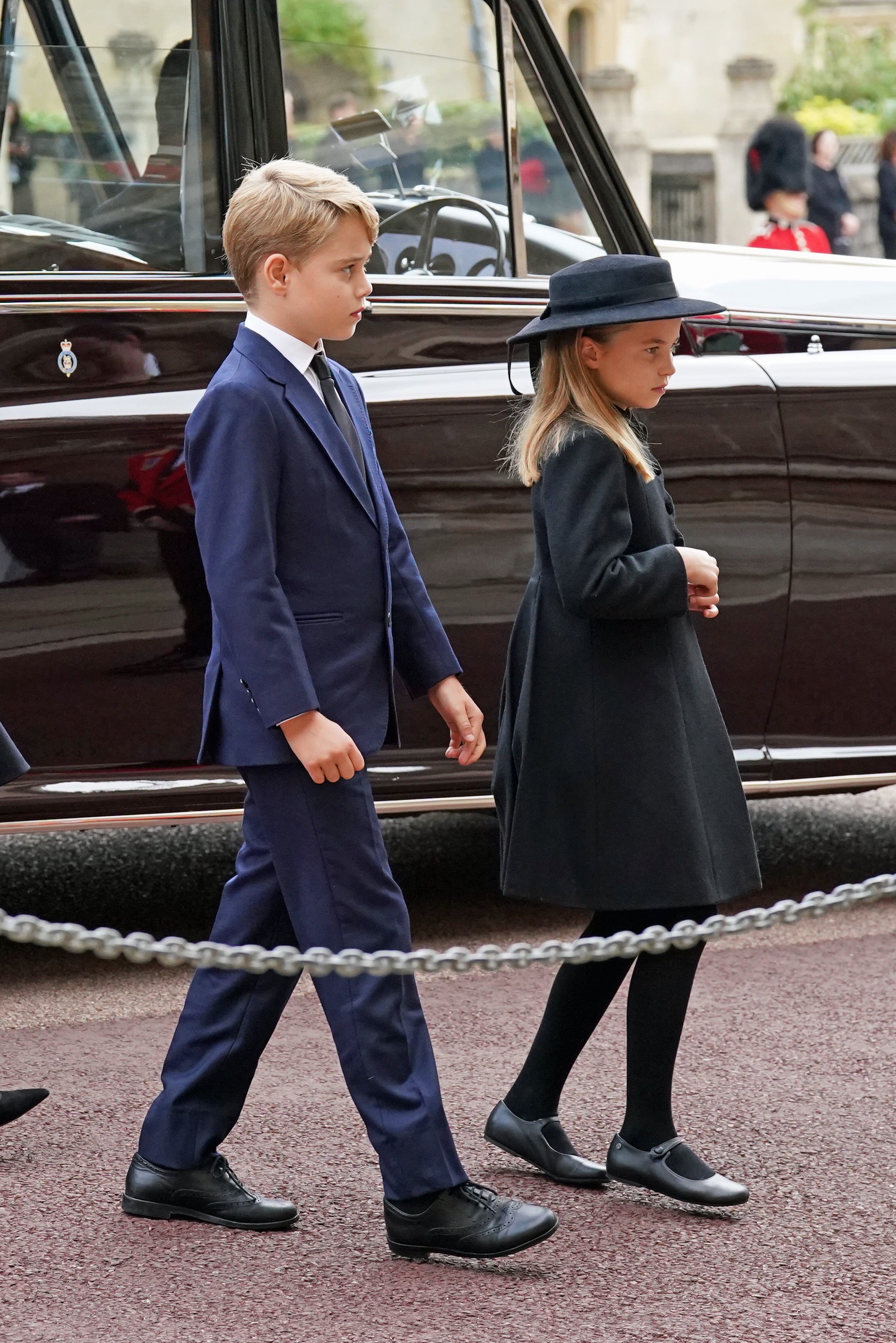 Prince George and Princess Charlotte arrive at the Committal Service for Queen Elizabeth II held at St George's Chapel in Windsor Castle on September 19, 2022 in Windsor, England. | Source: Getty Images