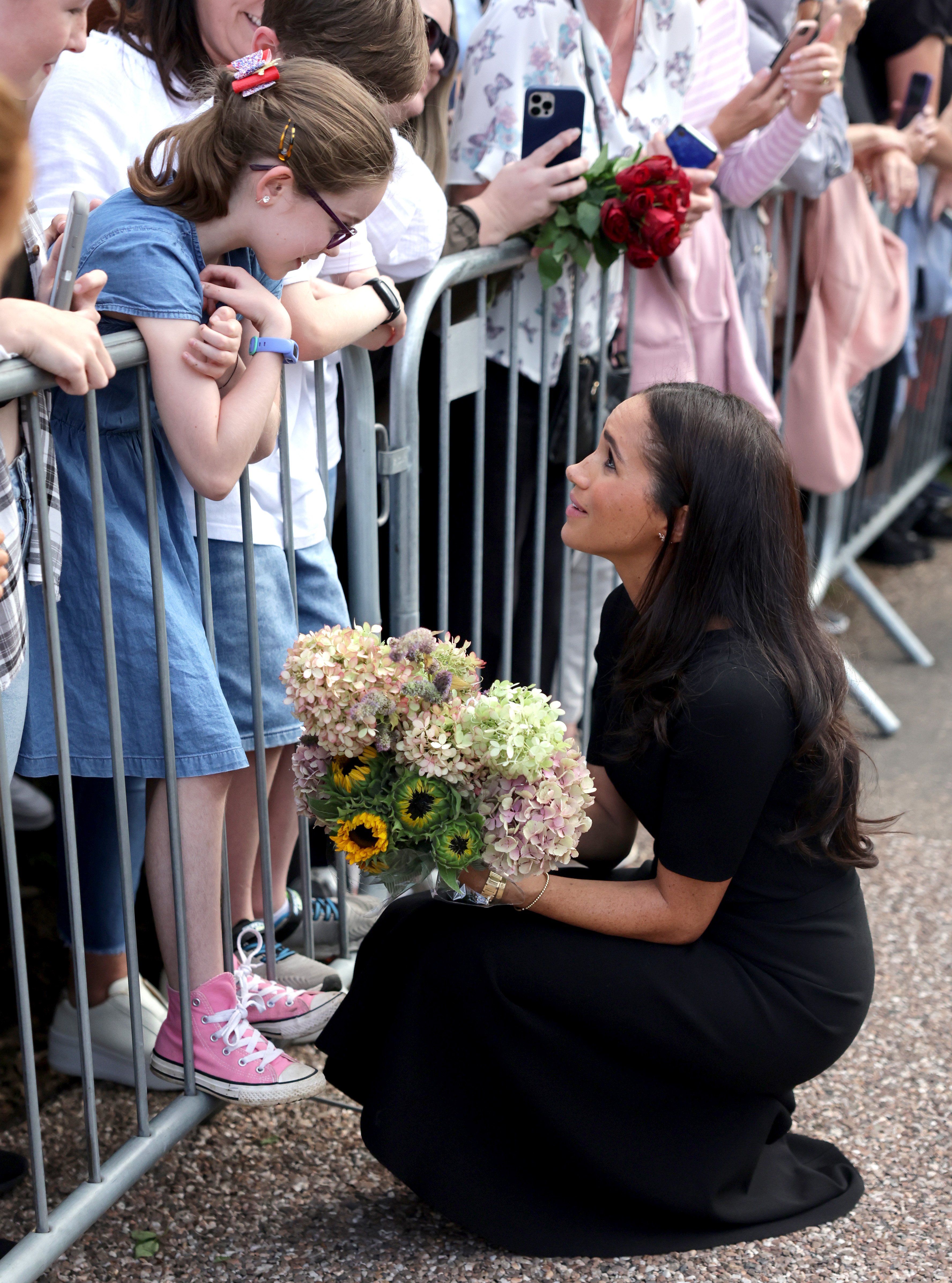 Meghan, Duchess of Sussex meets members of the public on the long Walk at Windsor Castle on September 10, 2022 | Sources: Getty Images