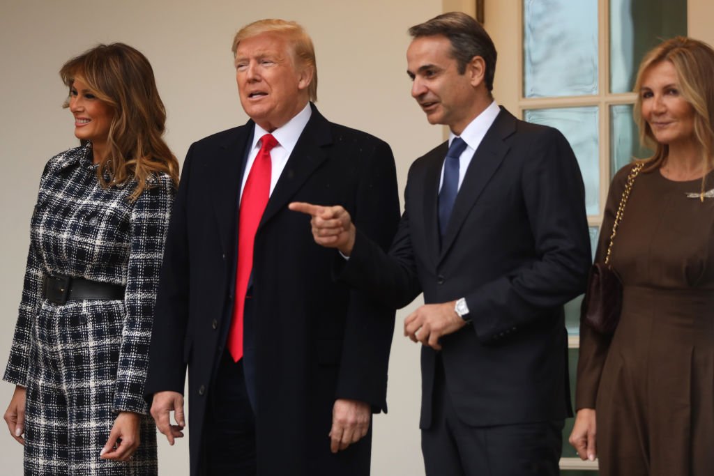 President Donald Trump and first lady Melania Trump pose for photos with Prime Minister of Greece Kyriakos Mitsotakis and his wife Mareva Grabowski-Mitsotakis at the West Wing colonnade of the White House. | Photo: Getty Images
